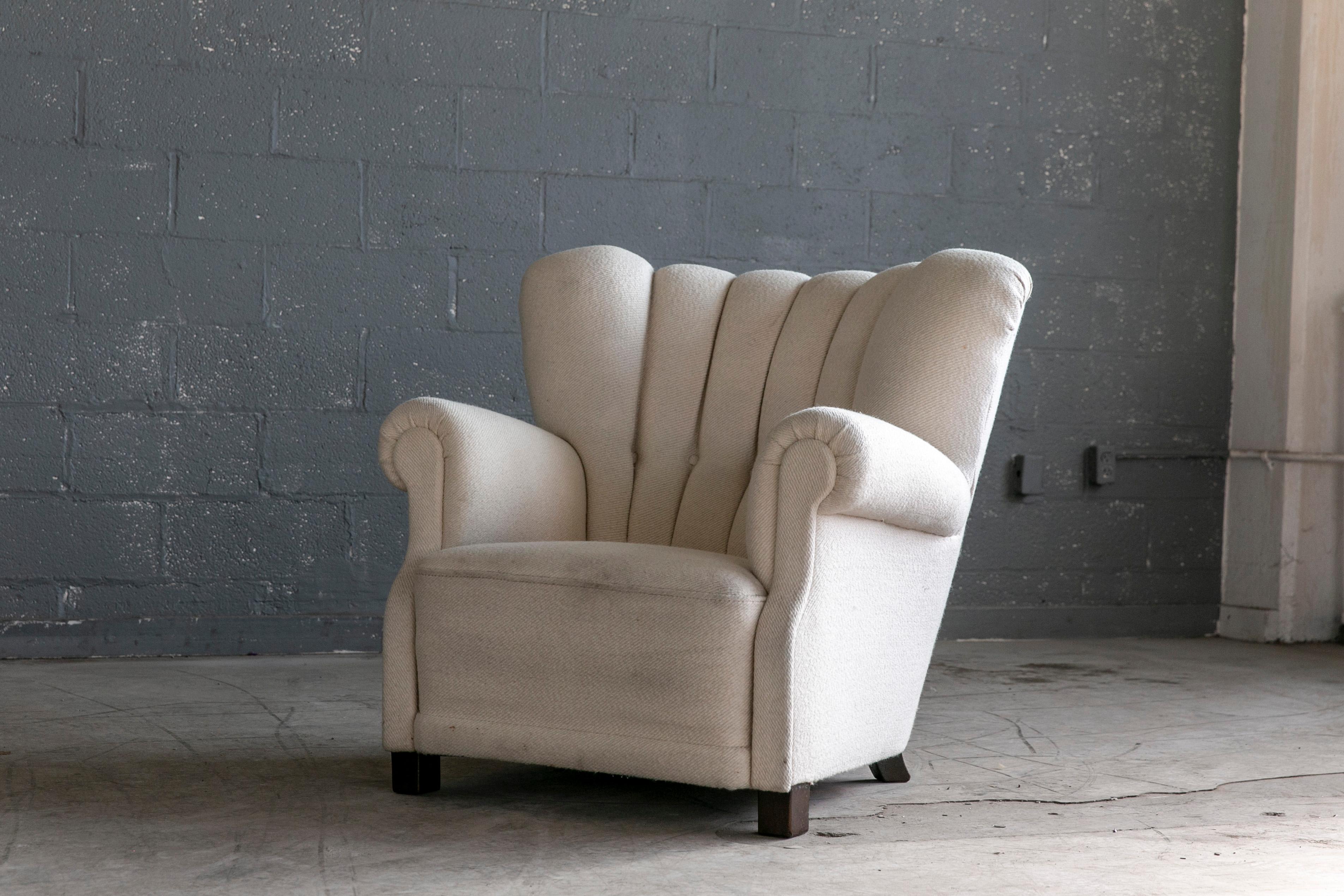 Sublime large scale club chair model 1518 by Fritz Hansen manufactured sometime in the 1940's. The model 1518 is a well-known and sought after Fritz Hansen design which was first seen in the company's 1942 catalog. We love the generous proportions