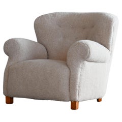 Fauteuil club de grande taille Fritz Hansen modèle 1518 avec dossier touffeté en laine d'agneau beige