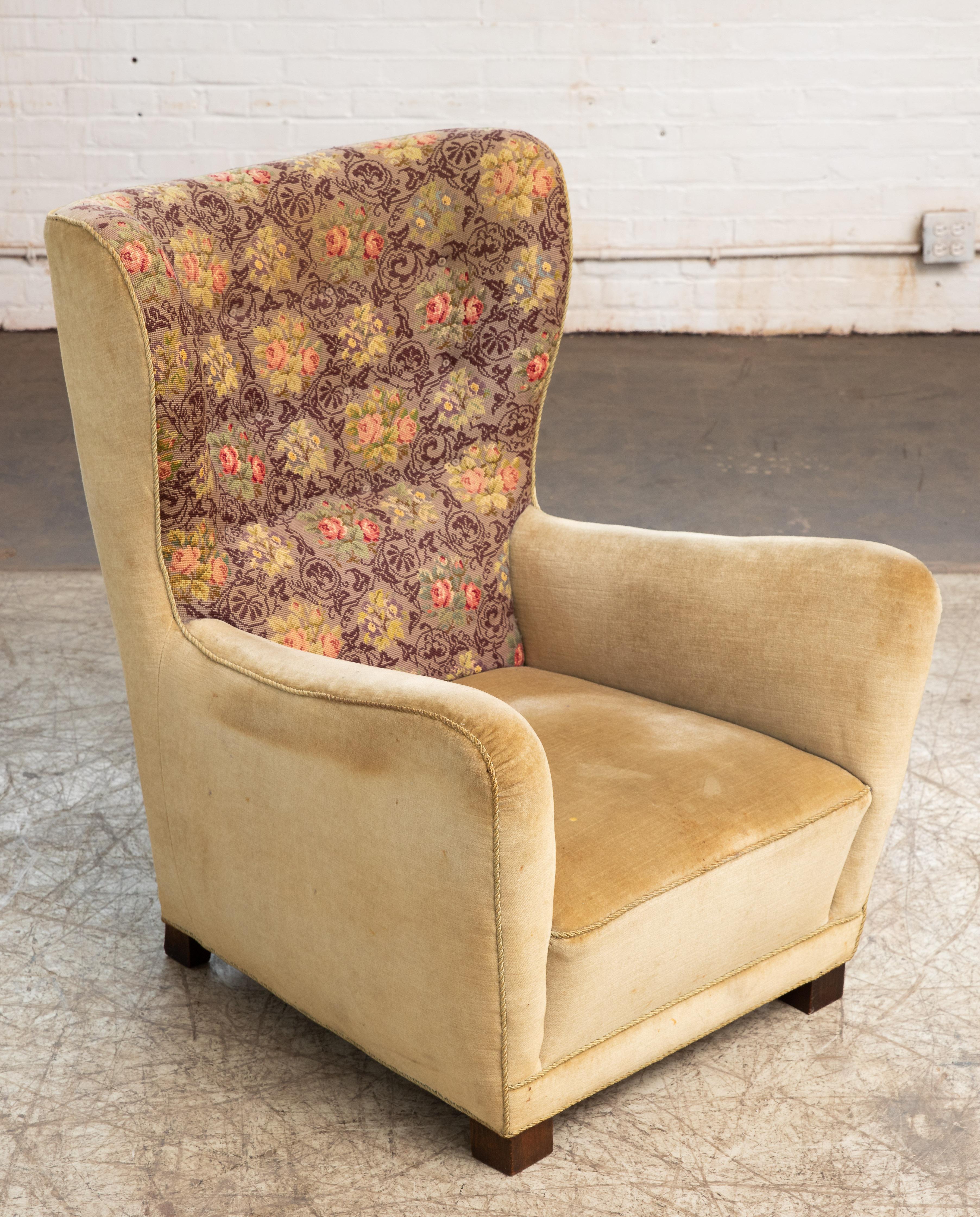 Sought after Fritz Hansen Model 1672 high back lounge chair made circa 1942. The chairs was first seen on page 12 in Fritz Hansen's 1942 catalog. The model 1672 has become of the most sought after and iconic high back chairs to come out of the
