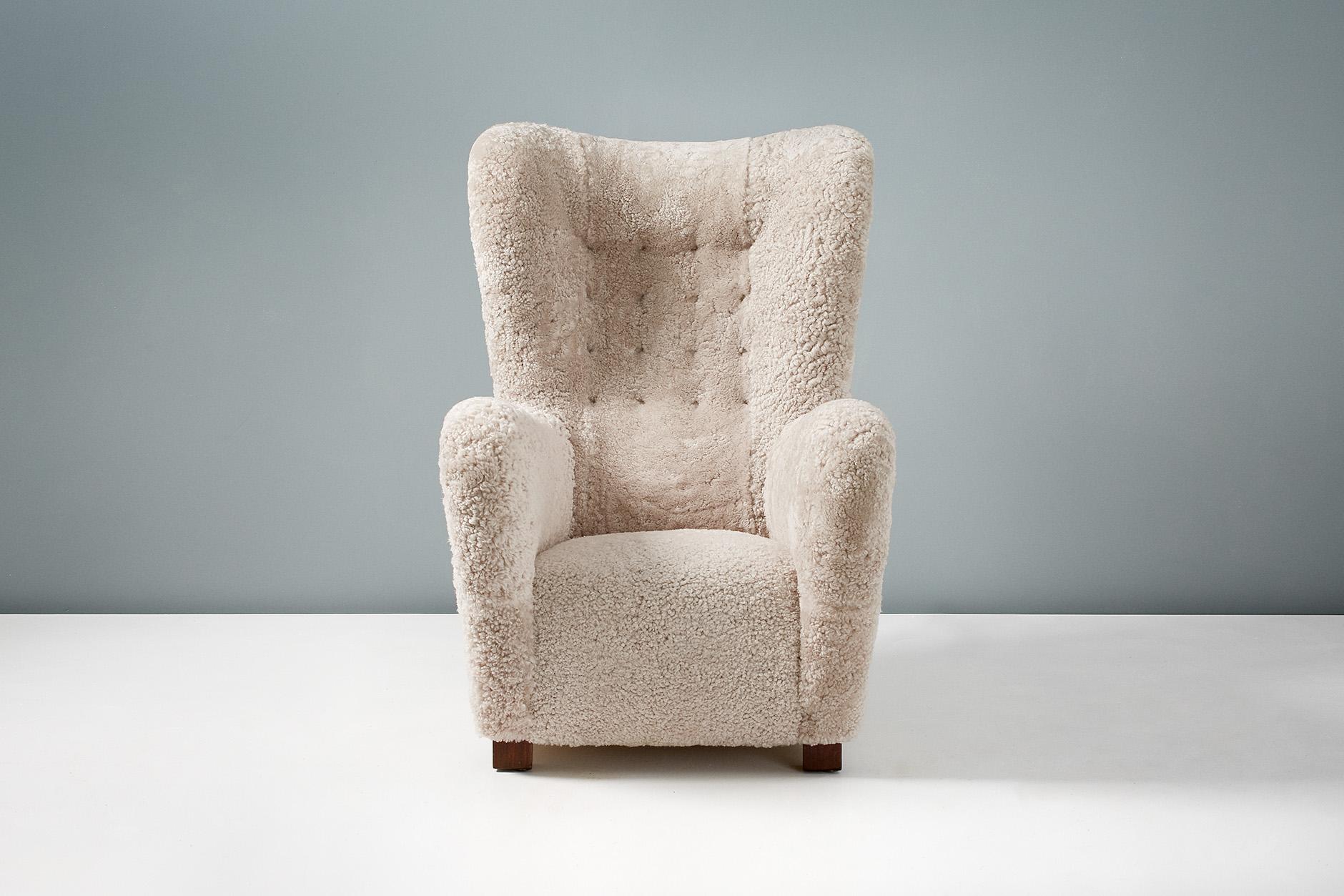 Fritz Hansen Model 1672 wing chair

Large wing chair produced in Denmark in the 1940s by manufacturers Fritz Hansen. The square beech wood legs have been stained and oiled and the chair has been completely reconditioned by our in-house team at our