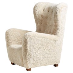 Fritz Hansen fauteuil à oreilles en peau de mouton modèle 1672, années 1940