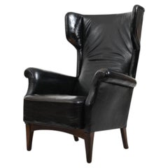 Fritz Hansen, model 8023 wingback lounge chair. Original patinated black leather