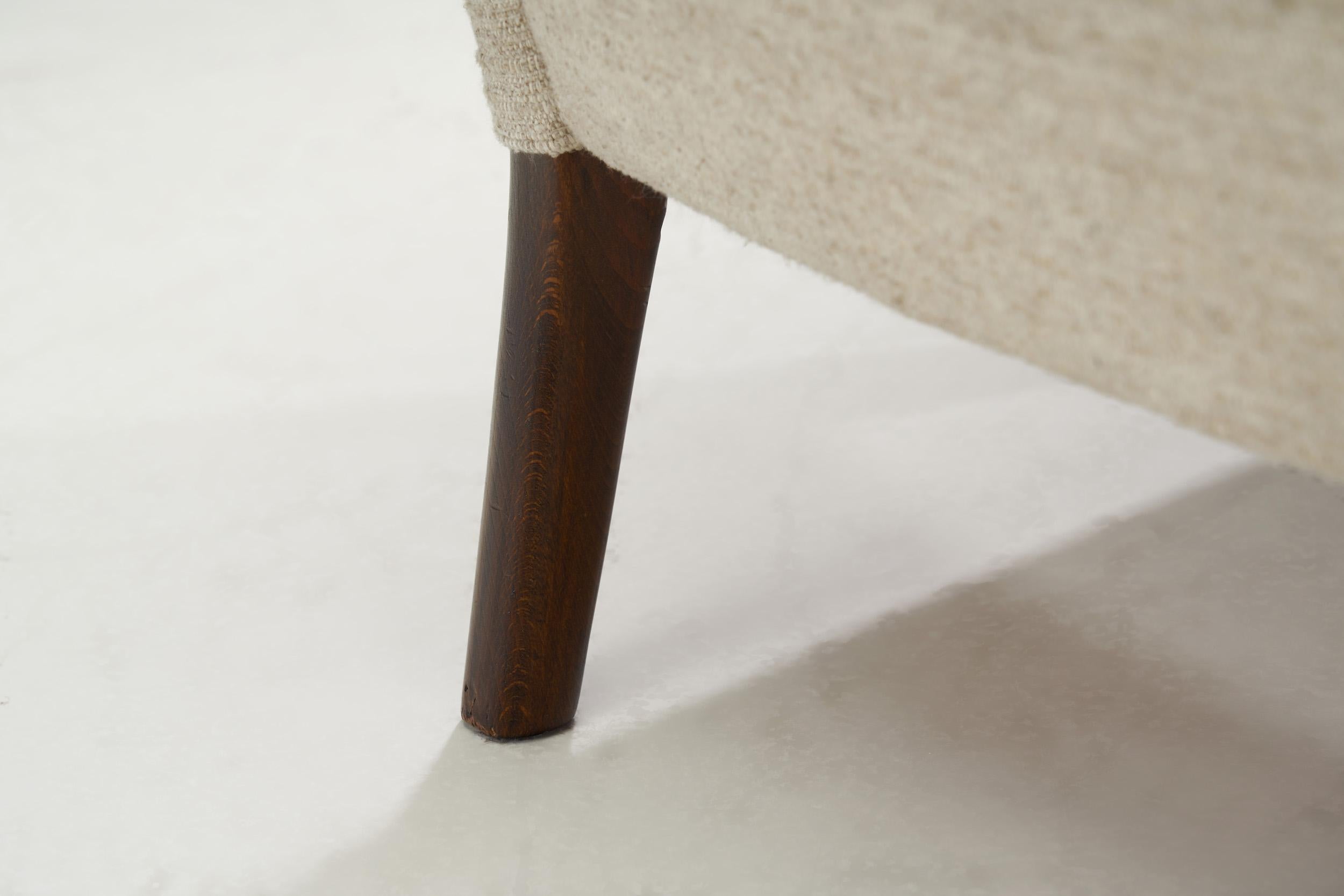 Poltrona a dondolo in bouclé Fritz Hansen modello 