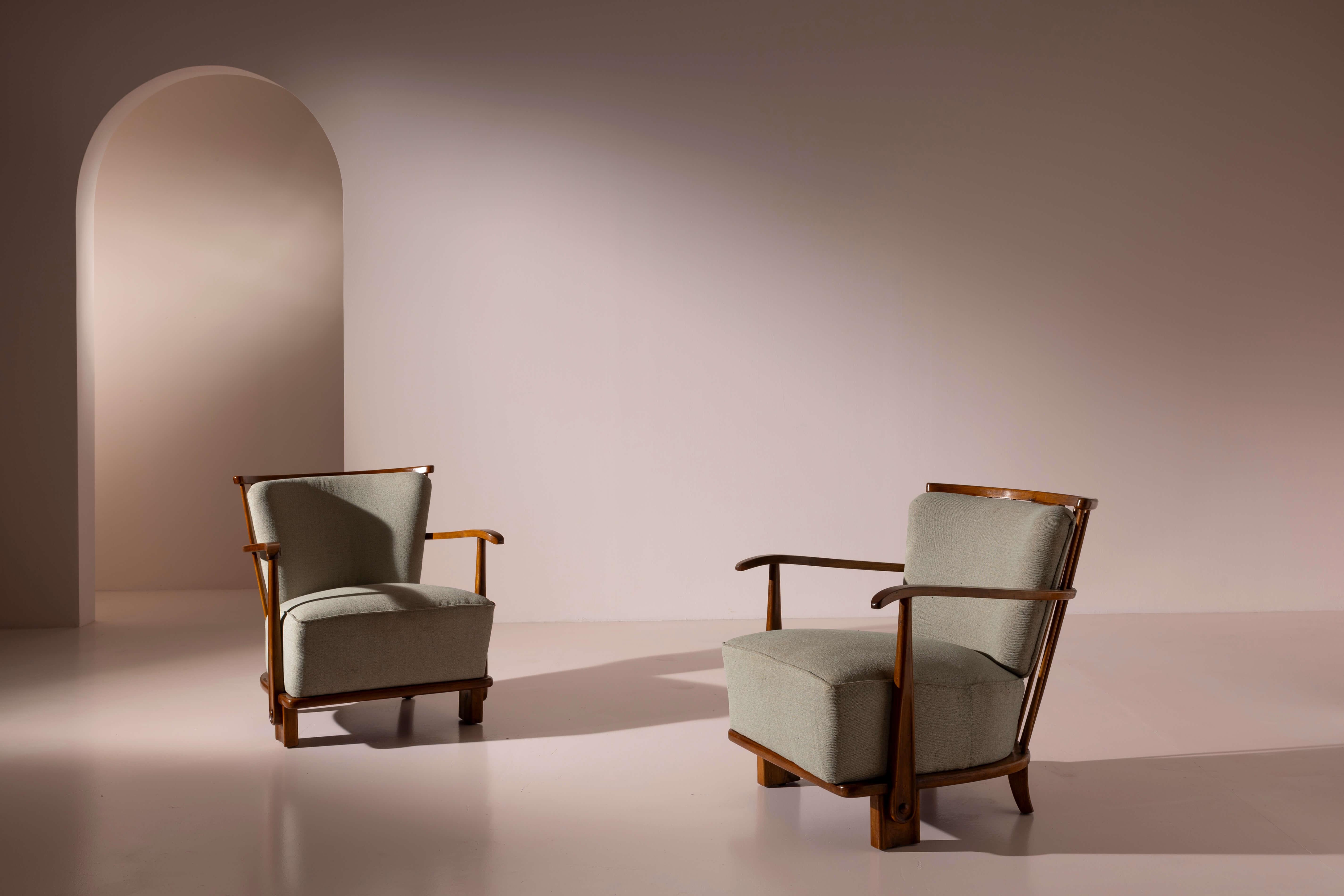 A rare pair of easy chairs with wooden frame and upholstered elements, Danish production, Fritz Hansen, Model 1590, 1942

Scandinavian furniture design is the result of a refined synthesis of craftsmanship, deep knowledge of materials, and a