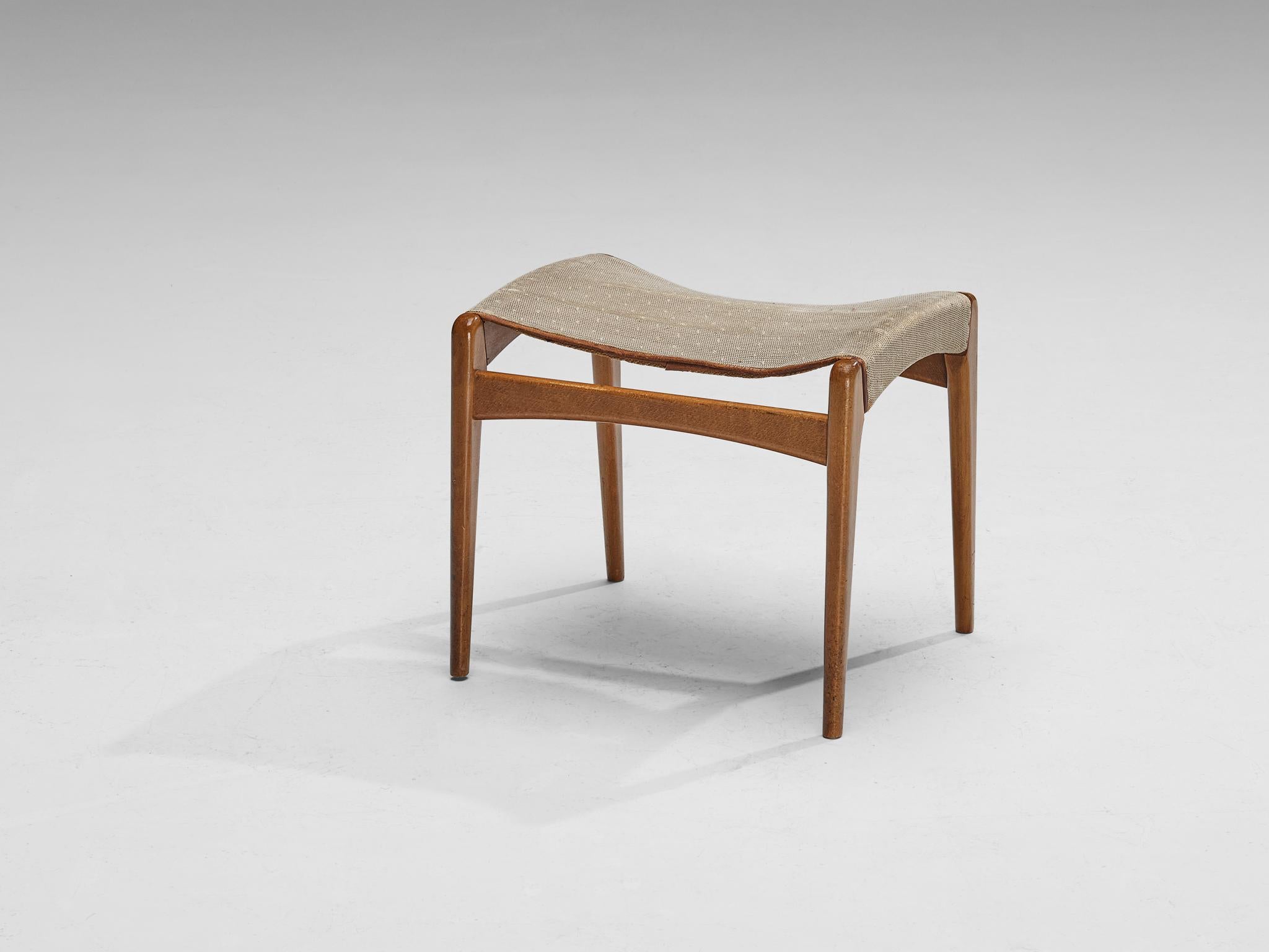 Fritz Hansen, stool or ottoman, model '1164', wool, beech, leather, Denmark, 1960s

Elegant in line and practical to use, this stool by Fritz Hansen is exemplary for Mid-Century Scandinavian Design. The wooden framework is comprised of four slender