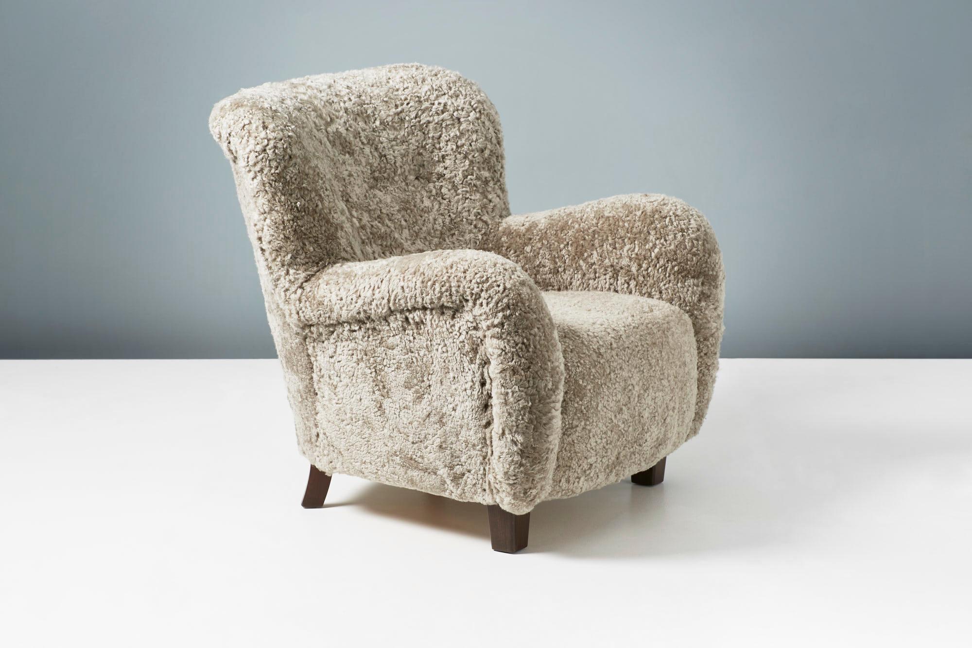 Danish Cabinetmaker
Lounge Chair, circa 1940s

A lounge chair in the manner of Fritz Hansen produced in Denmark in the 1940s. The chair has been completely reupholstered and covered in a warm grey Australian sheepskin. The feet are stained beech