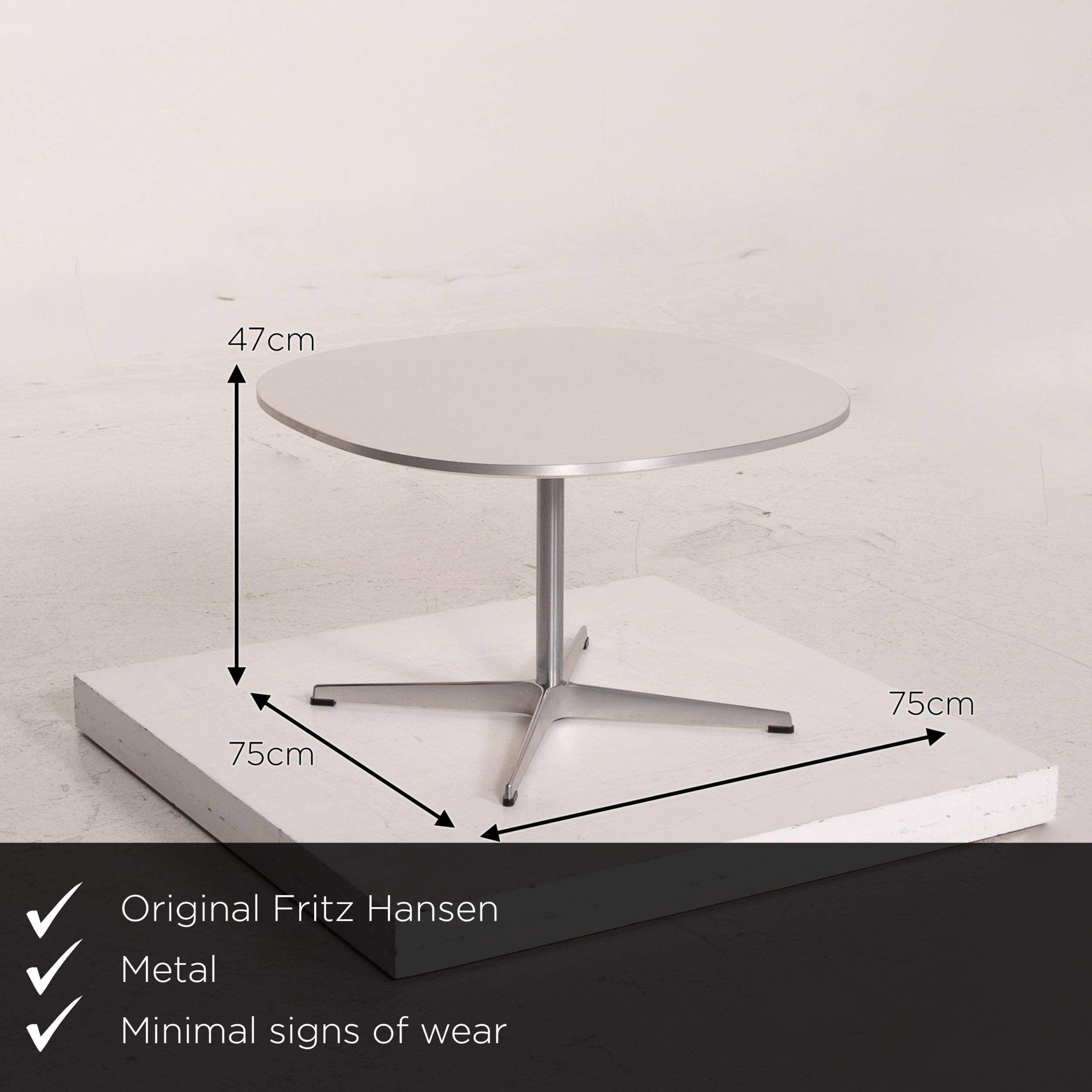 We present to you a Fritz Hansen Superellipse metal coffee table white side table.

 

 Product measurements in centimeters:
 

 Depth 75
 Width 75
 Height 47.





       