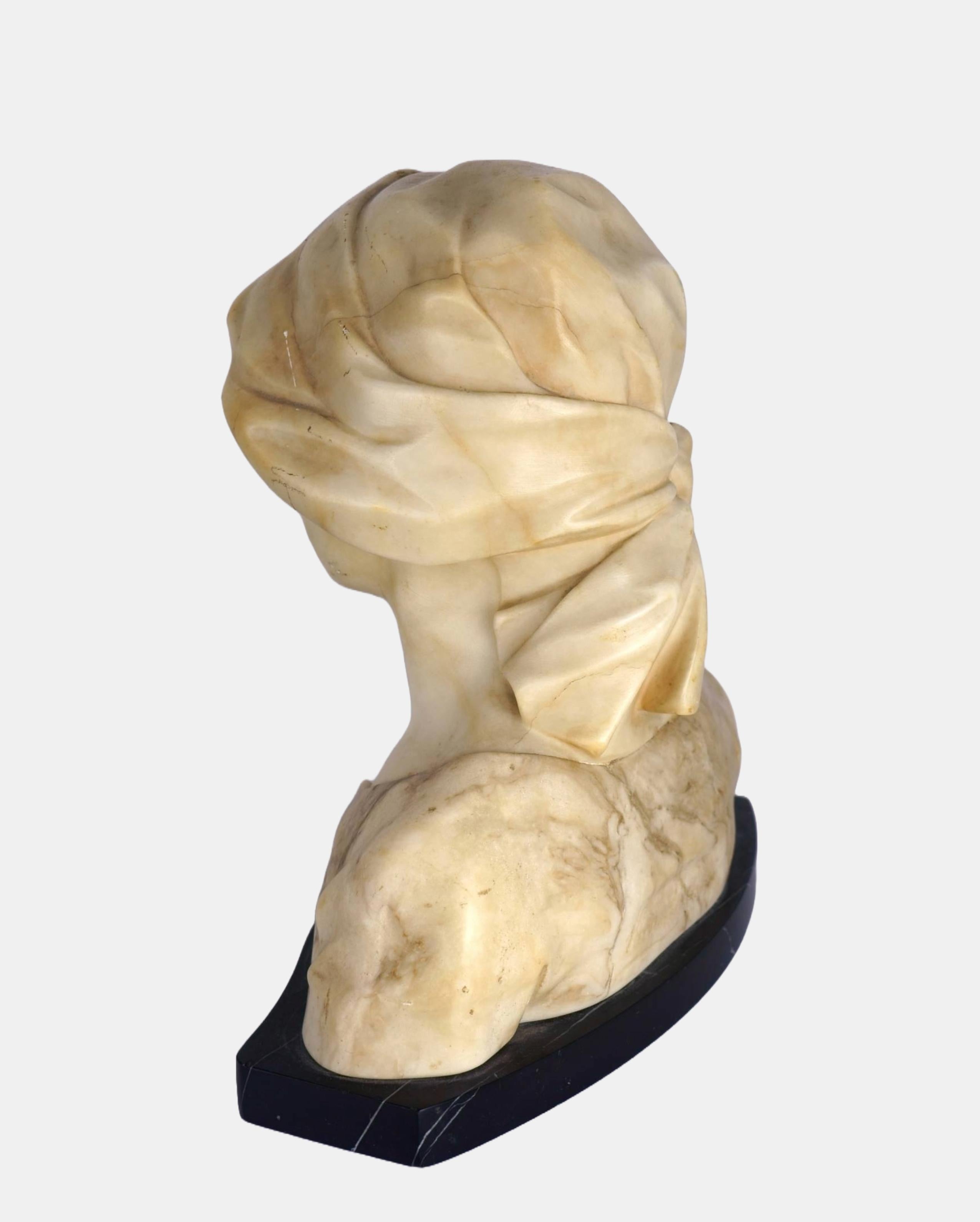 Fritz Kochendörfer (1871 Mannheim - 1942 Osterode am Harz), Bust of a young woman with headscarf, c. 1910. Two-tone alabaster on a curved black marble plinth, 24 cm (height) x 22 cm (width) x 14 cm (depth), 4.9 kg, signed “Kochendörfer fec[it].” and