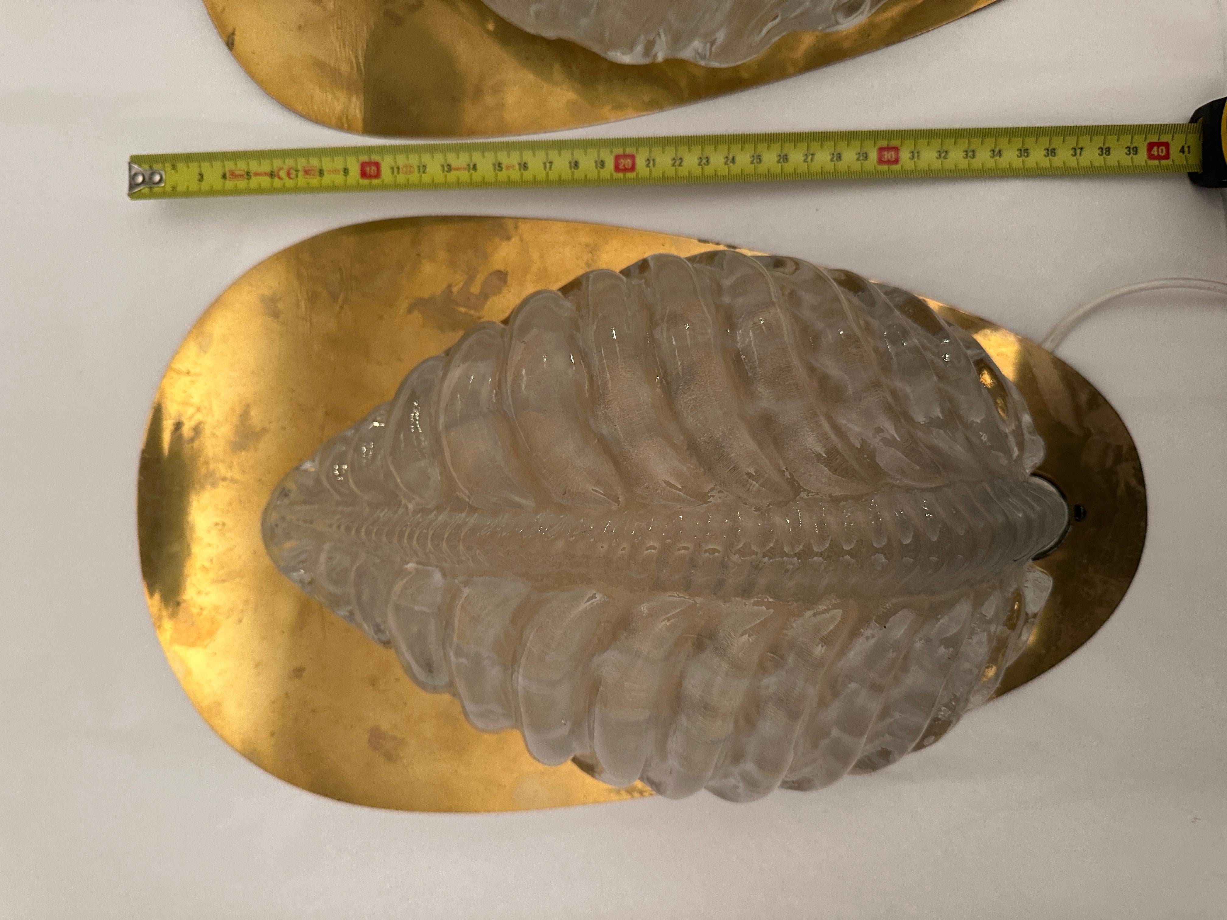 Very rare sconces by Fritz Kurz for Orrefors molded glass on brass plates. electrification not tested 
Good condition, some tarnished marks on brass that can be cleaned on request.
A pair available price for 1 item 