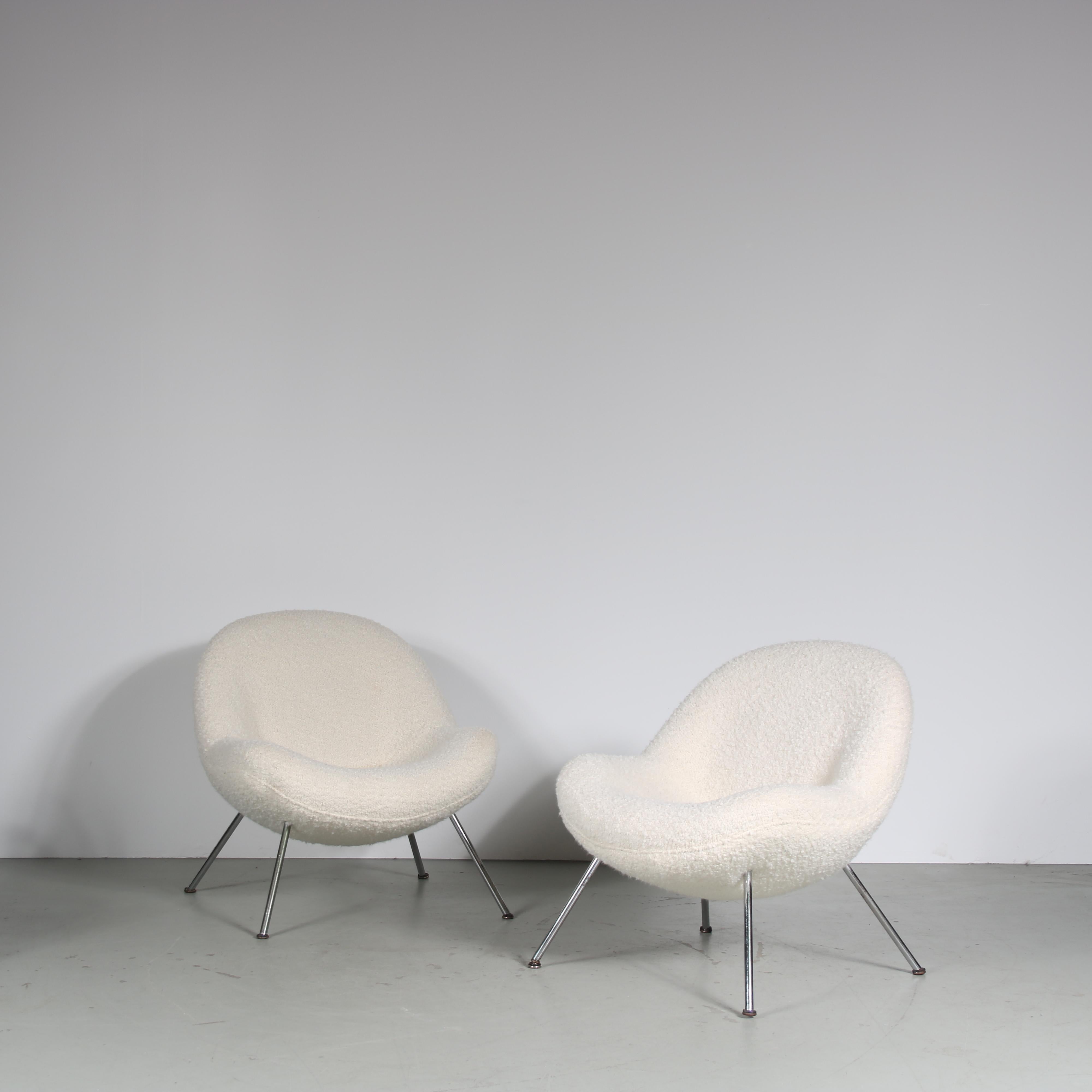 A fantastic pair of so called “Egg Chairs”, designed by Fritz Neth and manufactured by Correcta in Germany around 1950.

This inviting chairs have a very nice appeal, their rounded shapes and soft bouclé upholstery make them a beautiful and