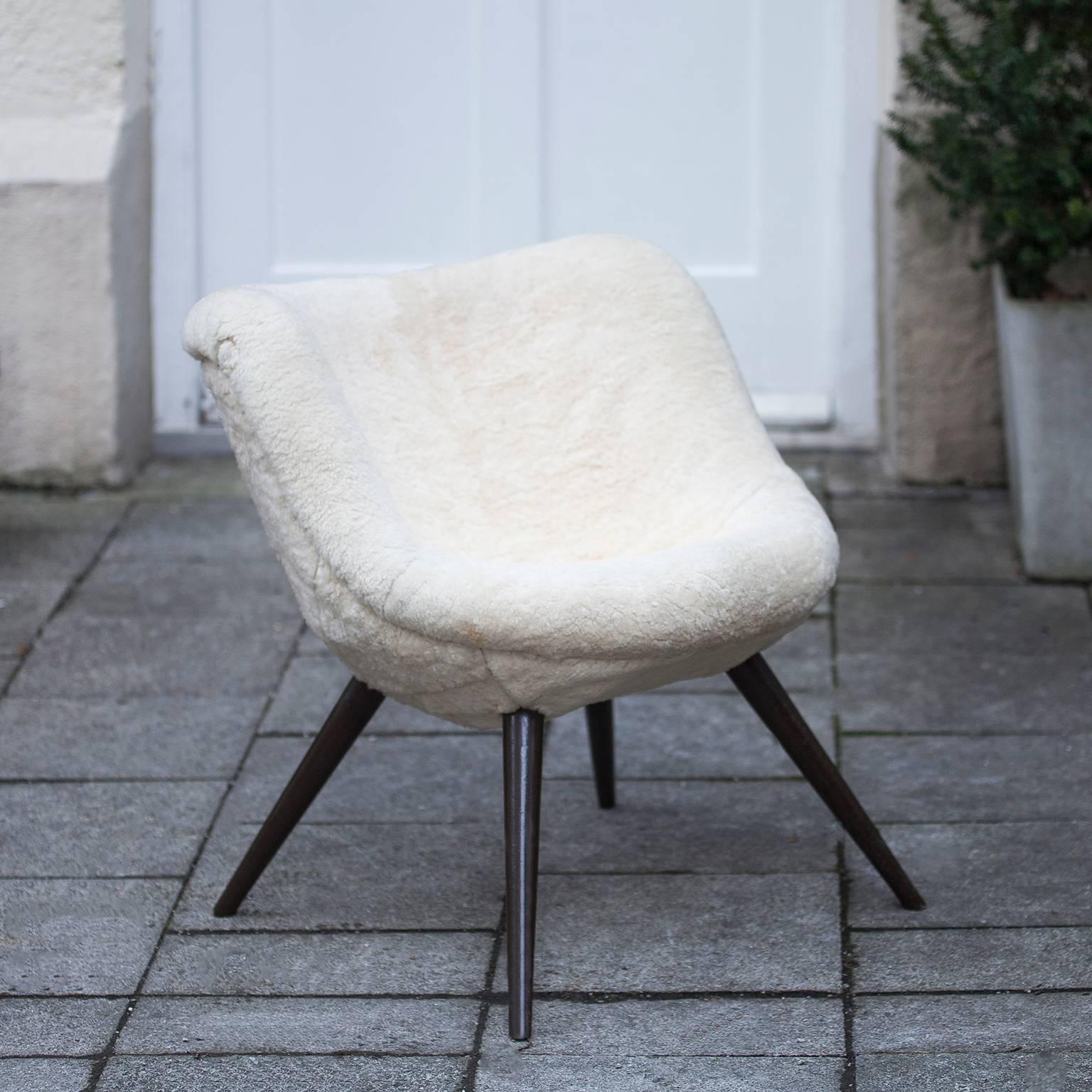 Lounge chair with sheep fur in the manner of Jean Royere and attributed to Fritz Neth.

 