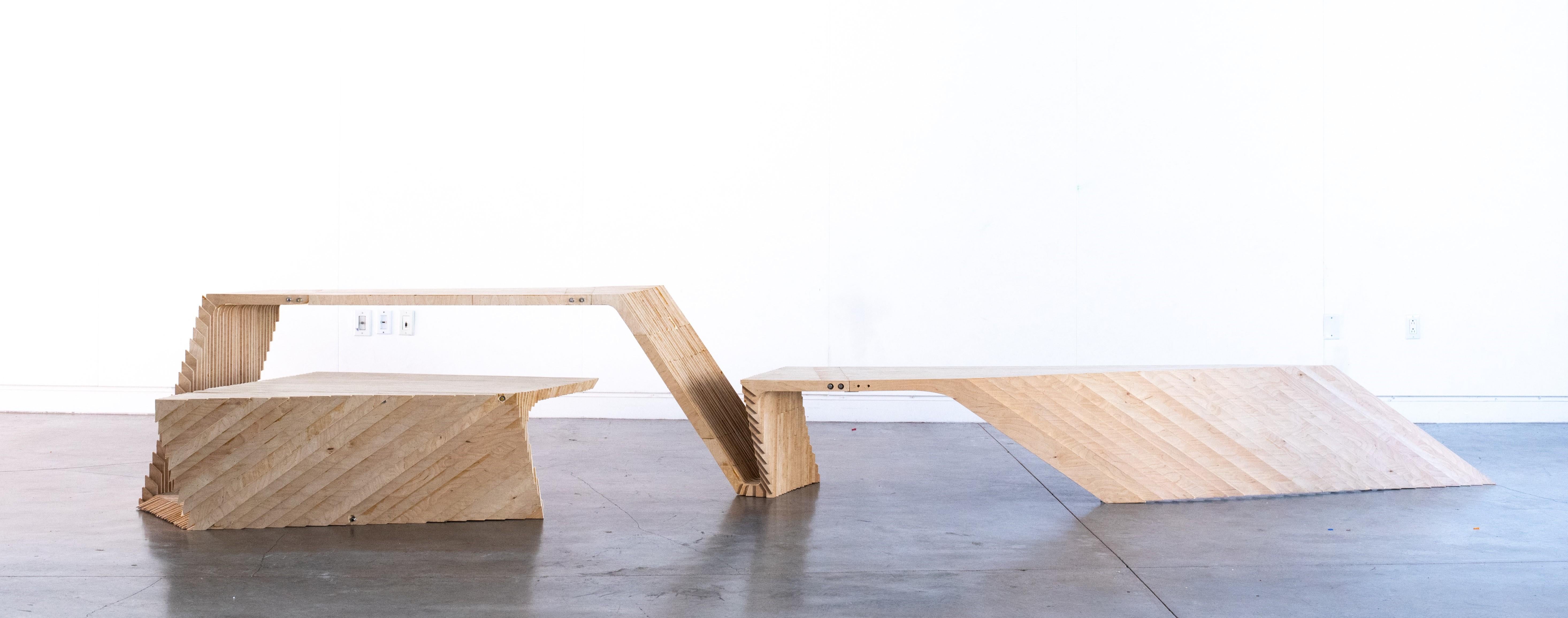 The FRM Bench is a multi-use furniture piece designed and fabricated by FRM Studio in 2018. The bench's dynamic design allows users to experience the piece as a seating element, a desk, and a table. This bench is designed for indoor use and is