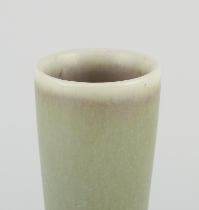 Frode Bahnsen (1923-1983) for Palshus, Denmark.
Large and narrow ceramic vase in light green hare fur glaze.
Model number: 1179
Dating: Circa 1970.
Signed FB for Frode Bahnsen.
Condition: In perfect condition
Dimensions: H 19,8 cm. x D 5.5 cm.