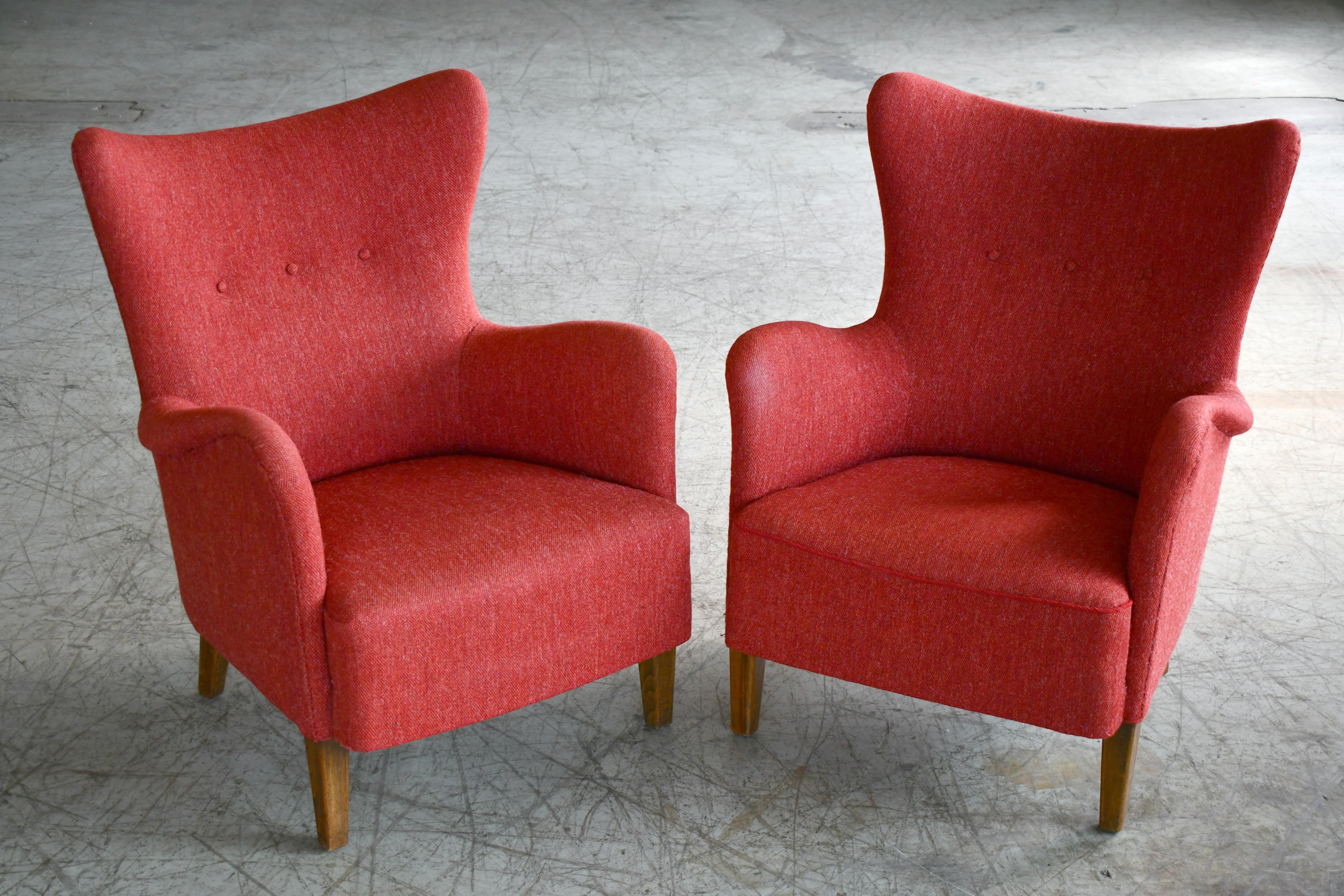 Superbly elegant and very rare pair of Frode Holm designed lounge chairs. The chairs were first mentioned in a Danish magazine for Industrial art in 1944 and were produced for Premier Copenhagen- based retailer, Illums Boilighus which is still in