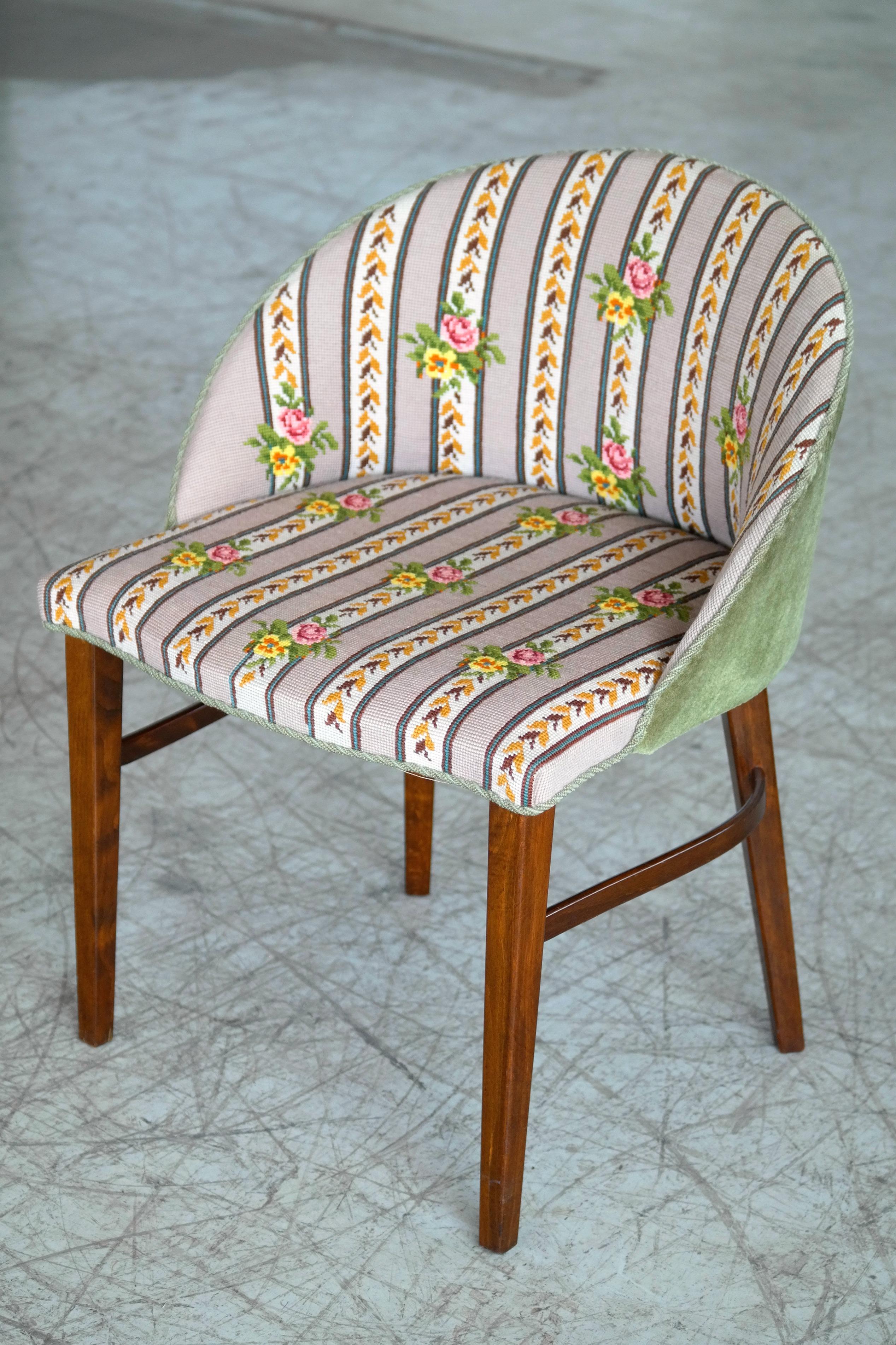 Variant of Frode Holms well-knows vanity chair. This version has a closed back and square cut legs made of mahogany. Super stylish chair perfect for the lady of the manor. Excellent overall condition with fabric and minor age appropriate wear to the