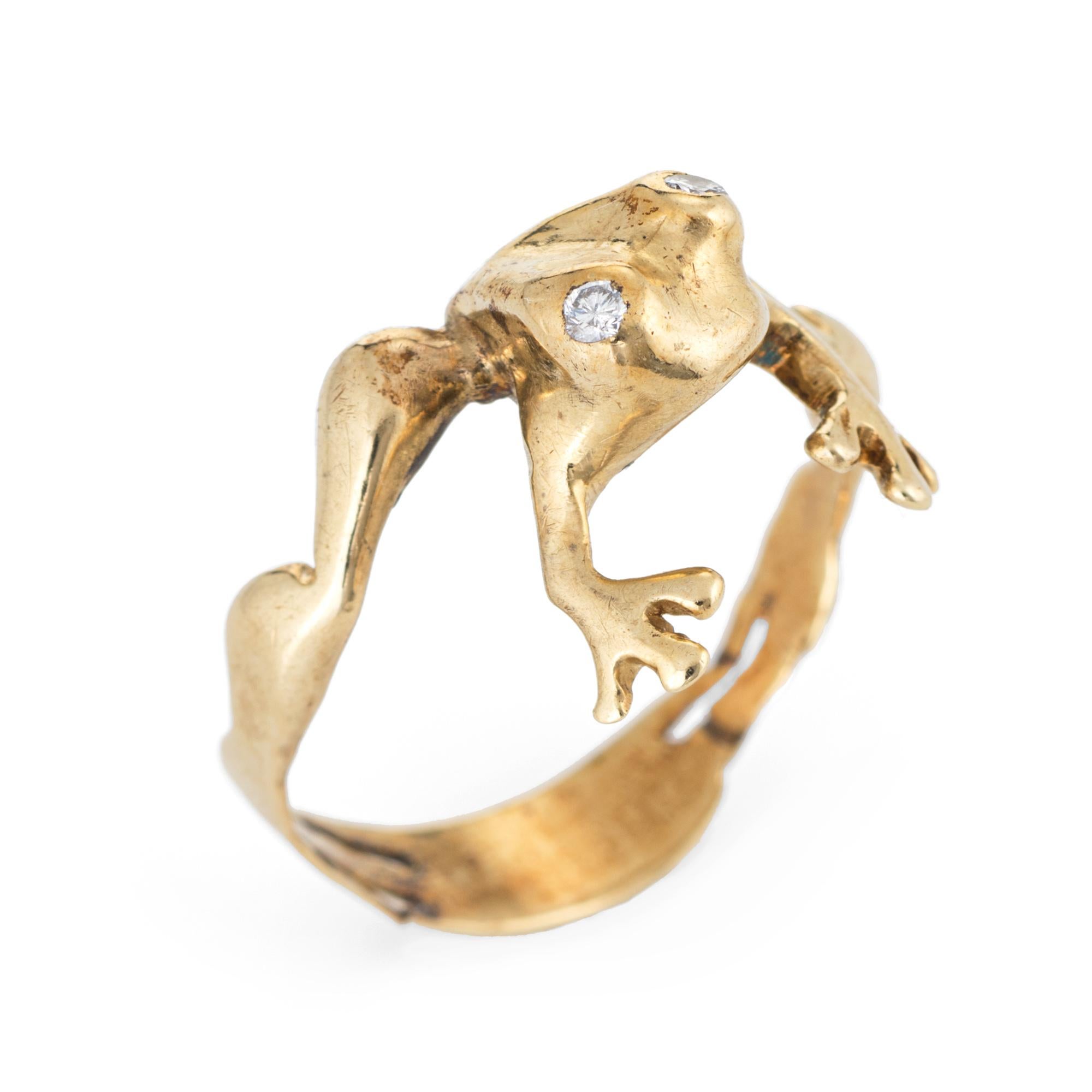 Stylish vintage frog band crafted in 14 karat yellow gold. 

Two estimated 0.01 carat diamonds are set into the eyes (estimated at H-I color and SI2 clarity).  

The sweet frog is designed to hug the finger and is finished with diamond eyes. The low