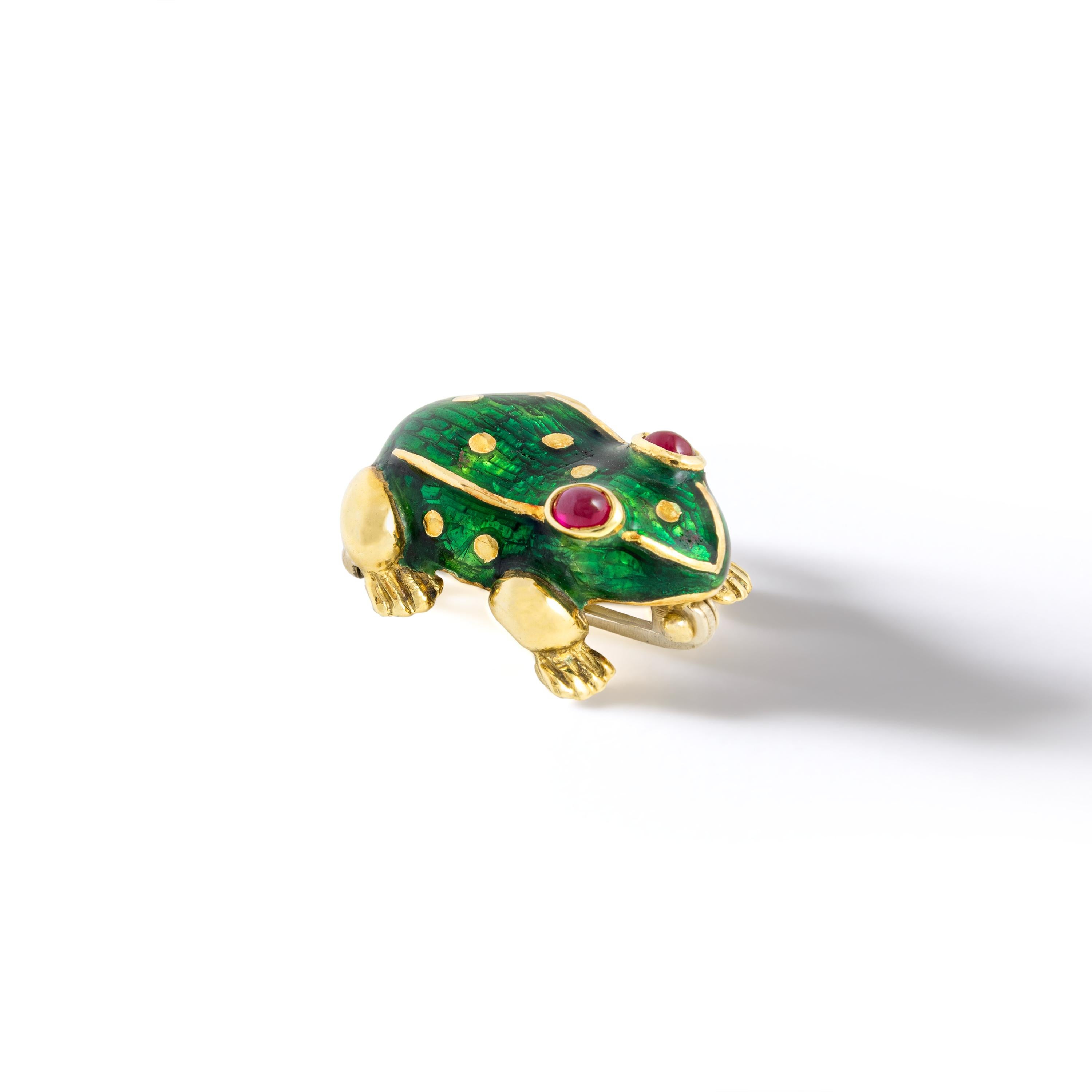 Frog yellow gold green enamel with ruby cabochon eyes Clip Brooch.
Chic and Elegant the perfect accessory on a jacket.

Total Length: 1.79 inch (2.00 centimeters).
Width at maximum: 1.71 inch (1.80 centimeters).
Total weight: 5.67 grams
