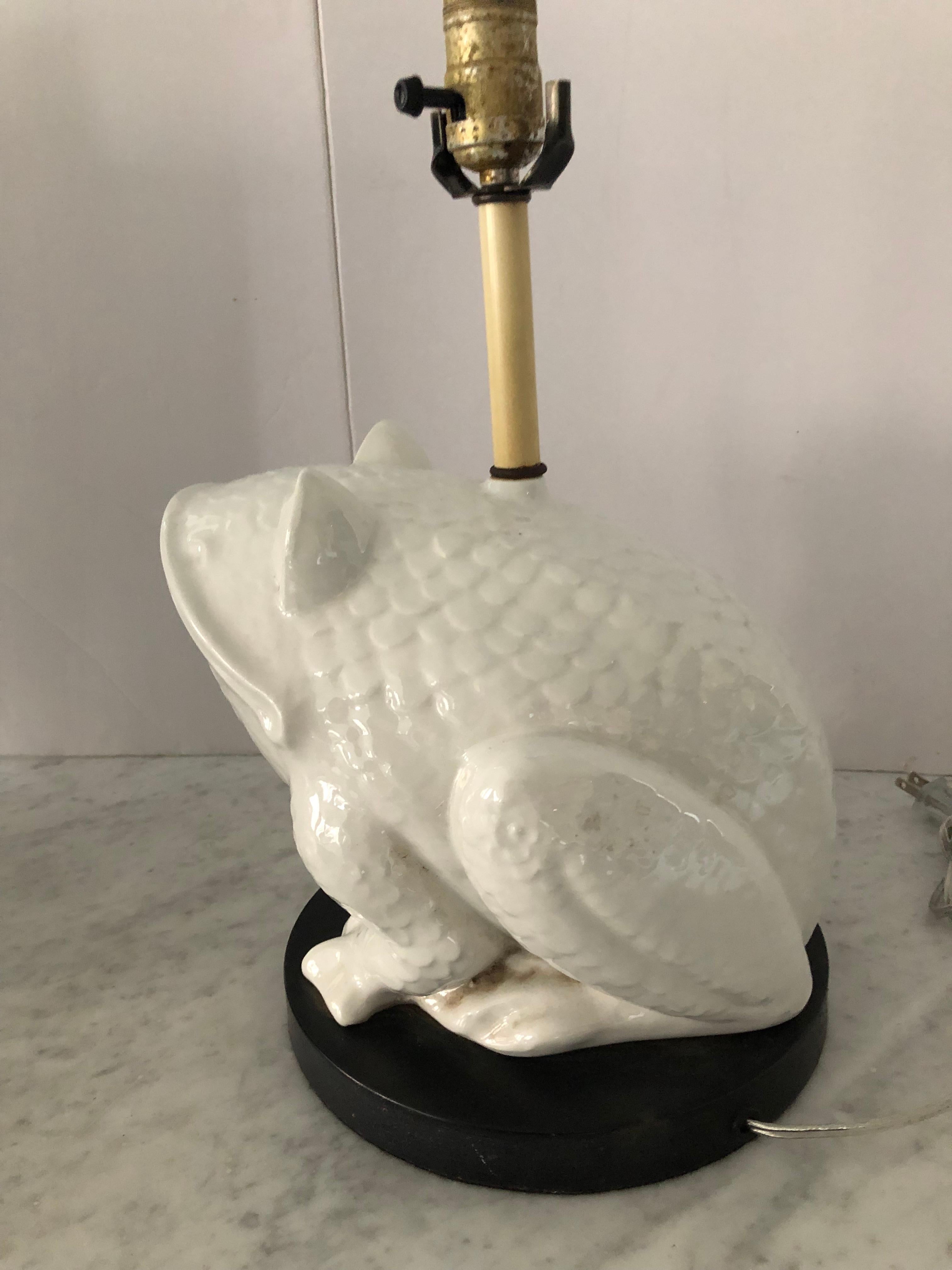 Midcentury ceramic frog table lamp on a black circular base, probably from Italy. The face has great personality! Shade not included.