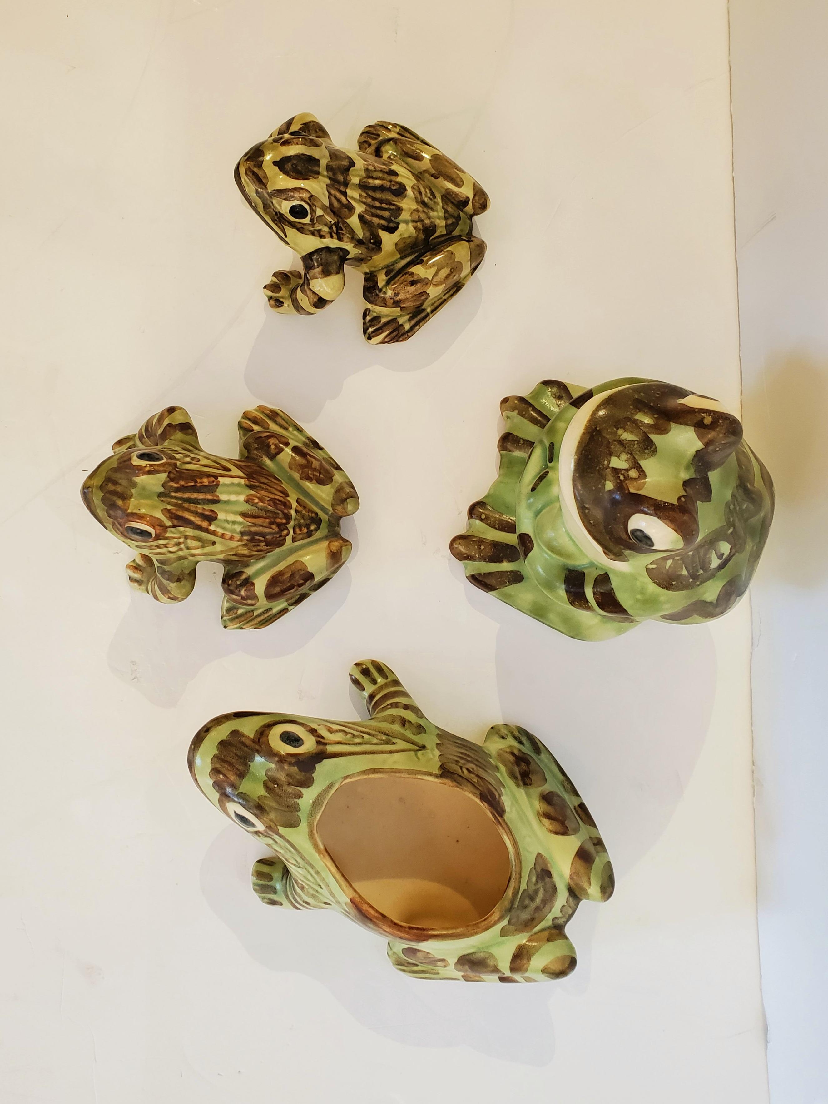 Adorable set of 3 ceramic frogs in light green, brown and cream.
Largest frog is sitting up with folded arms: 7 H x 5 W x 5.5 D
Frog with hole for use as a dish is in supine position: 8.5 x 6 x 3
Small frogs are poised ready to hop: 3 H x 5.5 D x 5