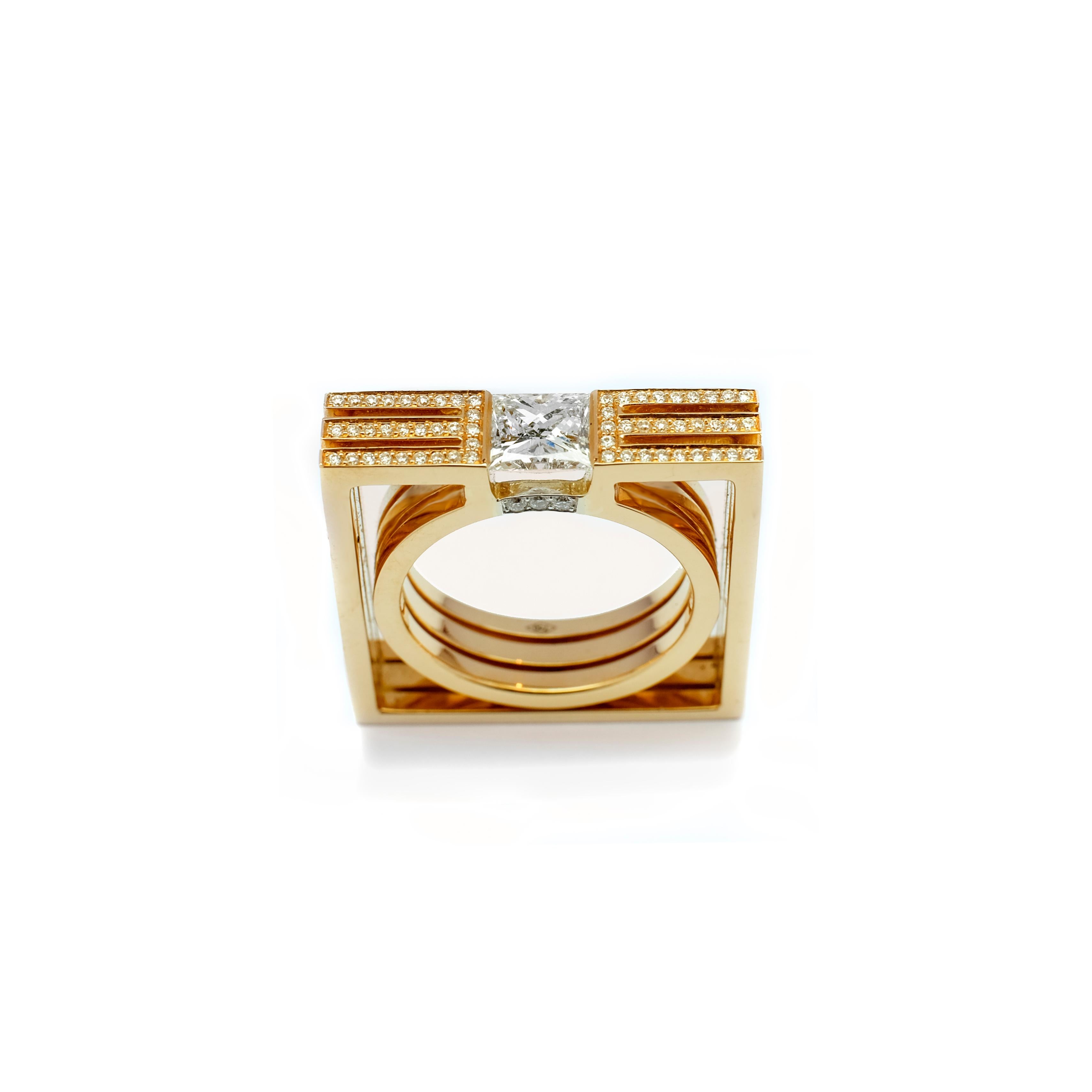 This square modernistic ring is made of 18 karat yellow gold.
The ring is not only pretty from the top it's also nice from the side views as seen in the pictures.
The center princess cut diamond is set without claws to give a floating effect, weighs