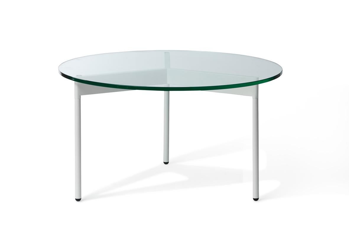 From Above coffee table clear glass warm white by Warm Nordic
Dimensions: D72 x H37 cm
Material: Tempered glass top, Powder coated steel legs.
Weight: 10 kg
Also available in different finishes and dimensions. 

A light, elegant coffee table with a