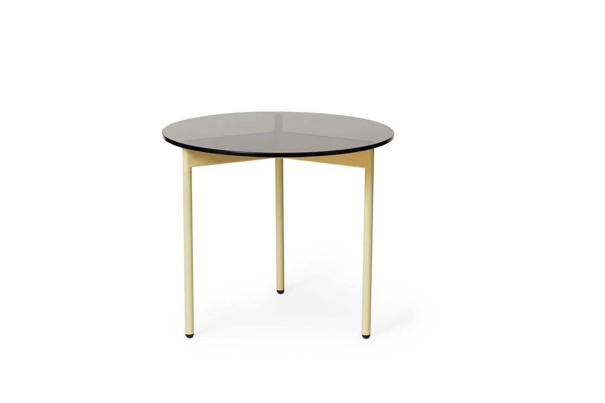 From Above Side Table Smoke Brown Glass Butter Yellow by Warm Nordic
Dimensions: D52 x H45 cm
Material: Tempered glass top, Powder coated steel legs.
Weight: 8.5 kg
Also available in different finishes and dimensions. Please contact us.

A