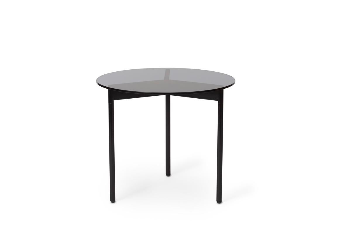 From Above Side Table Smoke Grey Glass Black Noir by Warm Nordic
Dimensions: D52 x H45 cm
Material: Tempered glass top, Powder coated steel legs.
Weight: 8.5 kg
Also available in different finishes and dimensions. Please contact us.

A light,