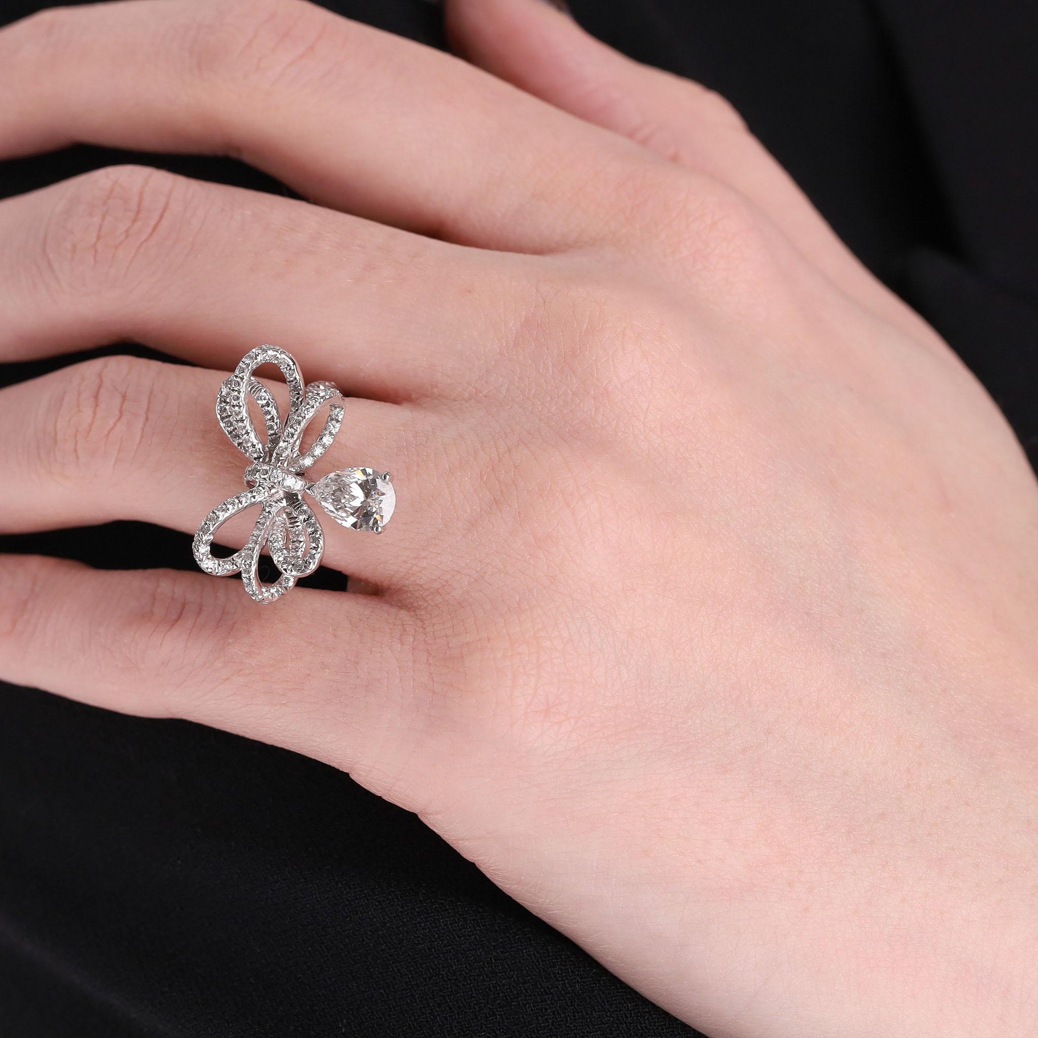 Rare Item - From Chanel High Jewellery Collection - Chanel Boucle Diamant Bow Ring 

Brilliant cut diamond encrusted bow ribbon with an articulated pear-cut diamond swinging from the knot.

Brilliant cut diamond encrusted bow ribbon with a pear-cut