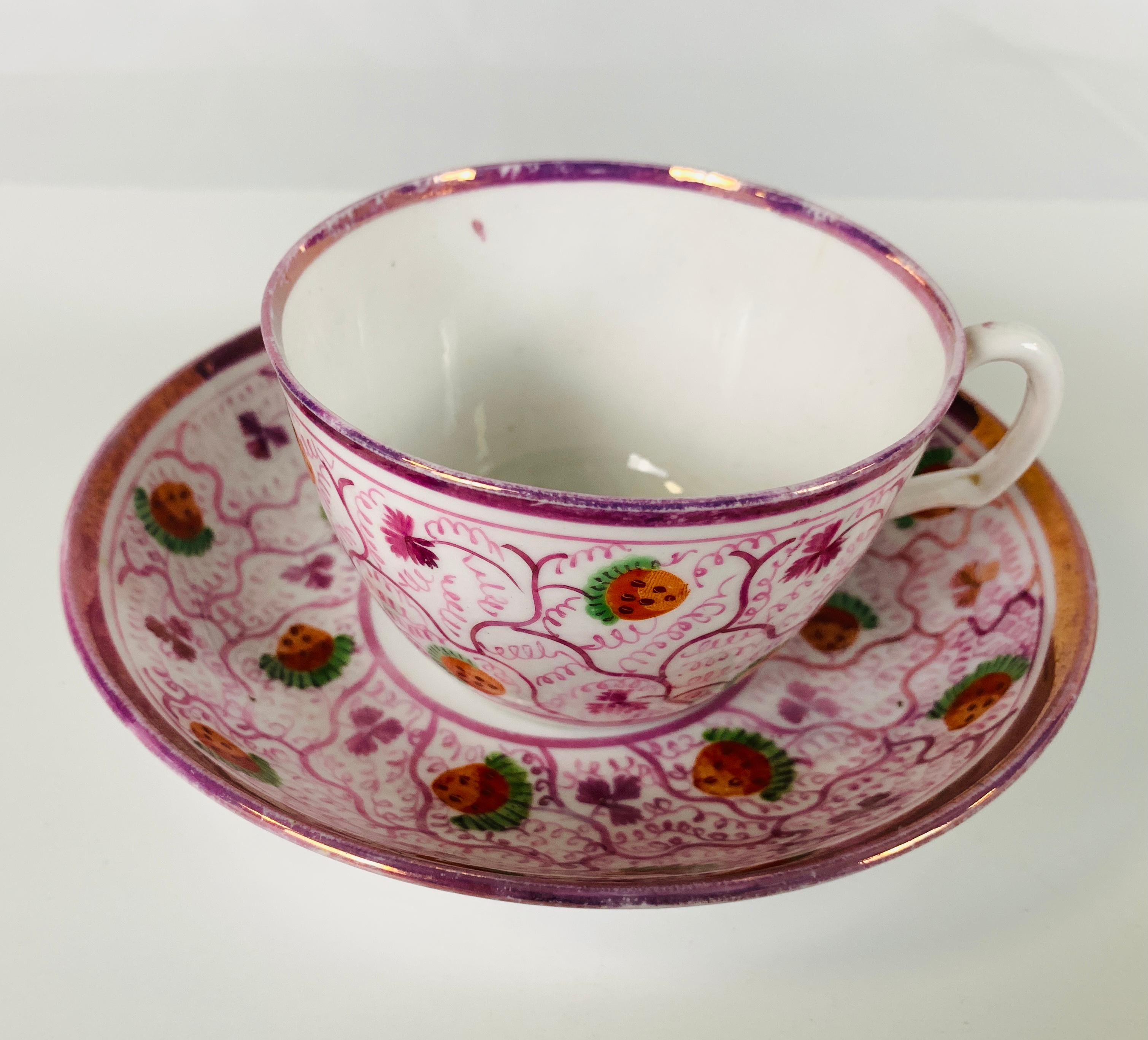 Provenance: The Private collection of Mario Buatta
A pair of pink luster teacups showing ripe English strawberries inside a luster trelliswork, with a single luscious strawberry at the center of the saucer.
Dimensions: 5.75