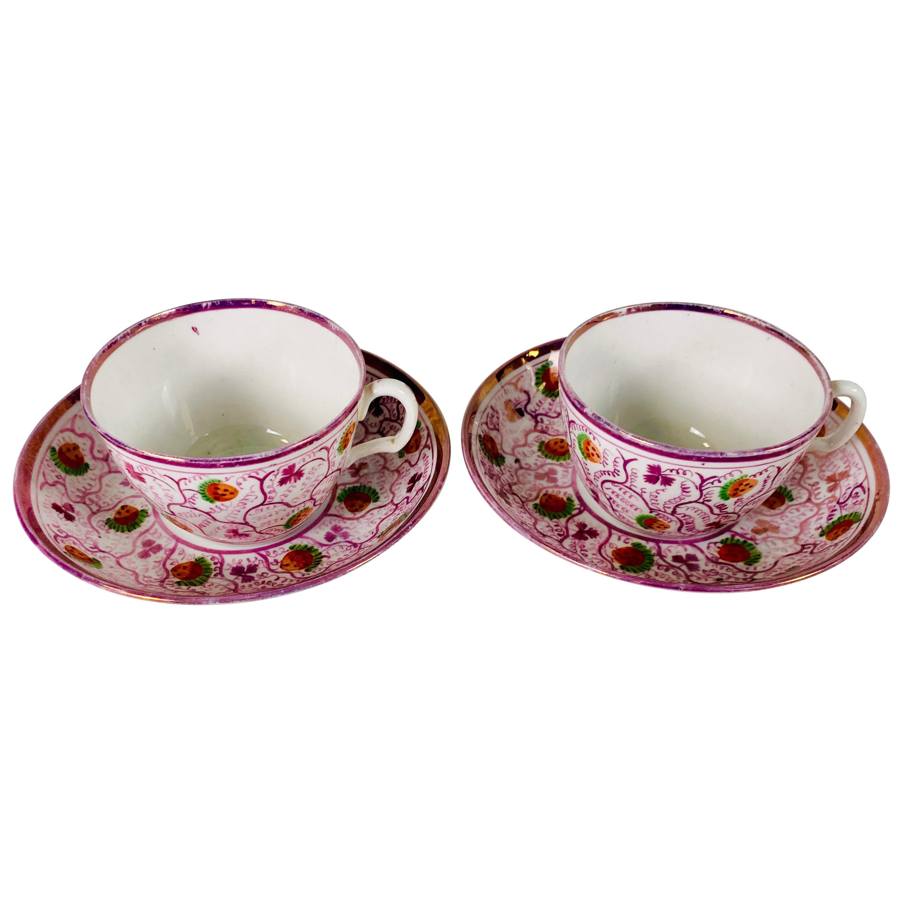From the Collection of Mario Buatta a Pair of Pink Luster Teacups