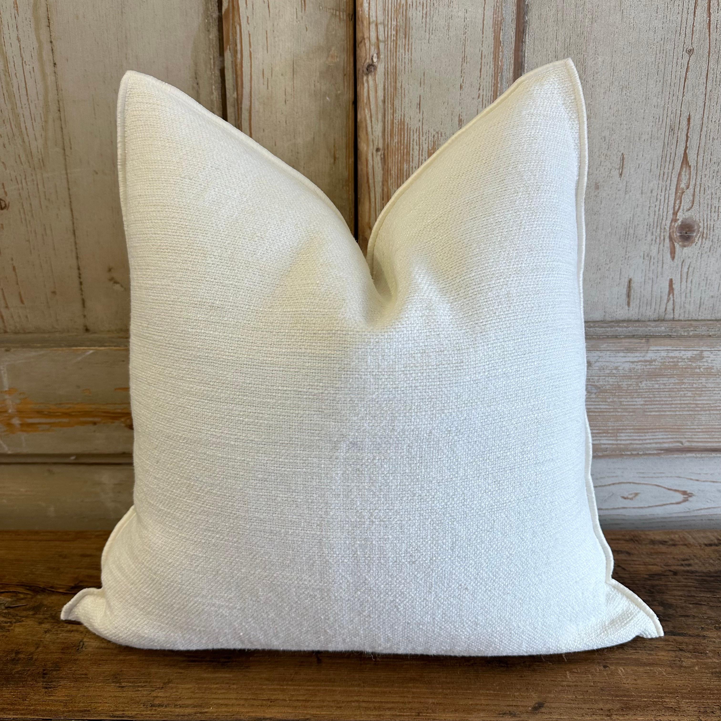 Nomade: Custom linen blend accent pillow. 
Color: White
A pretty oystery white color (not optic white)
Includes insert
Texture: nubby style pillow with a stitched edge, metal zipper closure. 
Our pillows are constructed with vintage one of a kind