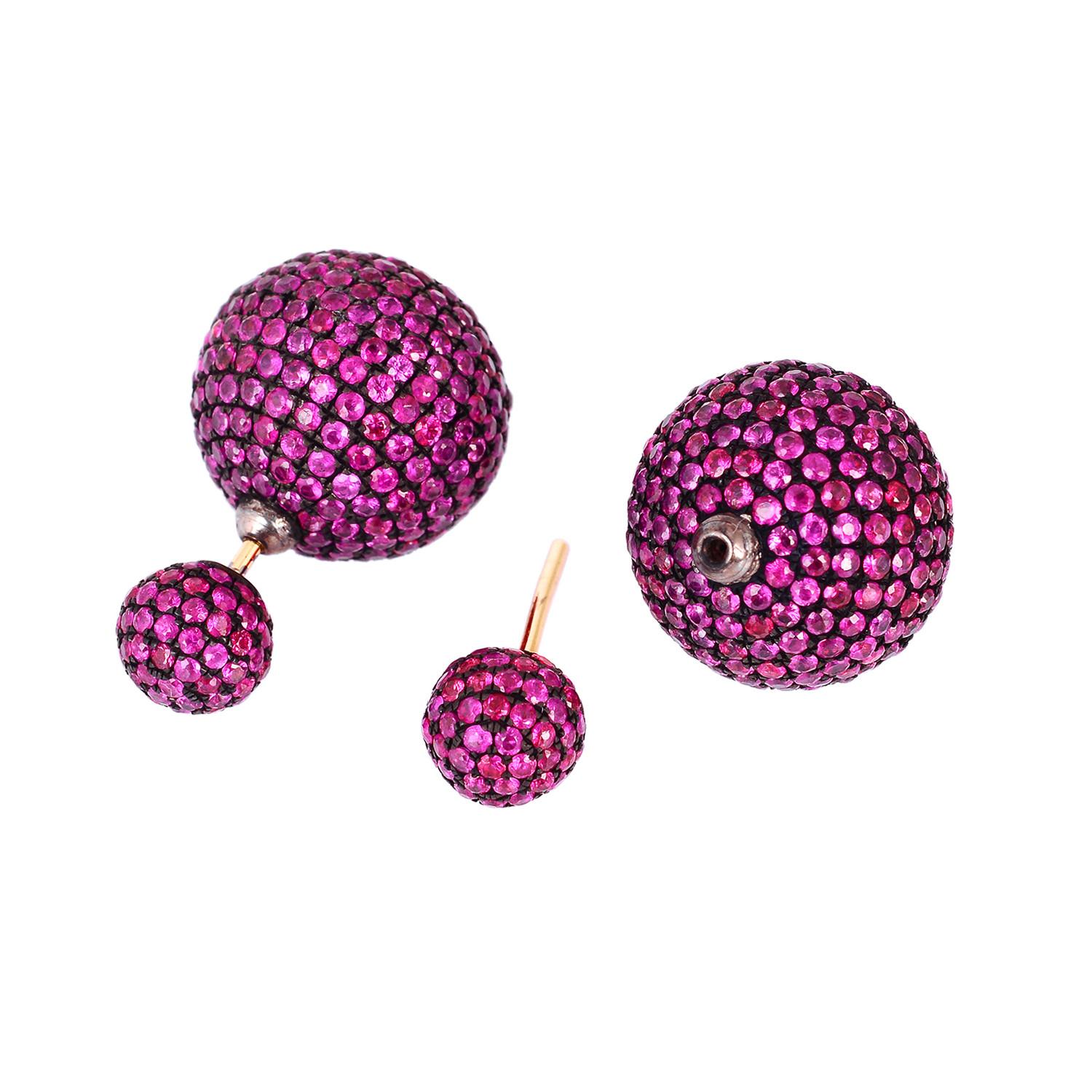 Be on top of the newest earring trend with a pair of double-sided stud earrings. Handcrafted from 18-karat gold & sterling silver, these stud earrings are set with 11.14 carats sparkling rubies.  Also available in diamond, emerald and blue
