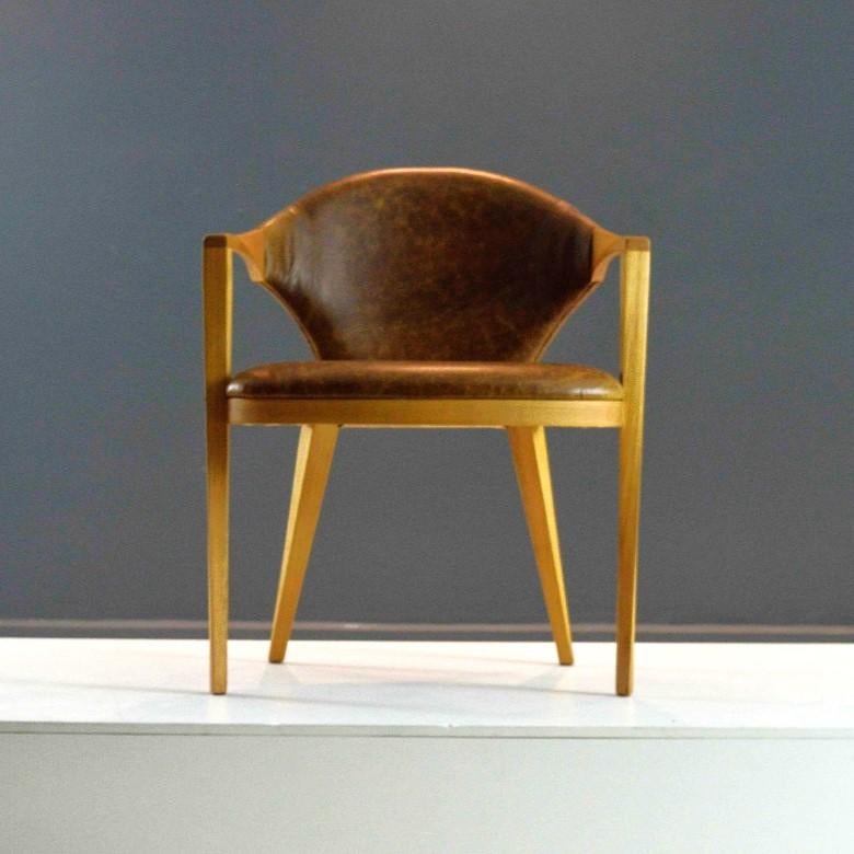 One of the project assumptions for this chair was the intense formal dialogue between different materials like wood and fabric. The designers came to a trace that fluidly and continuously interconnects these two materials.

A piece with strong