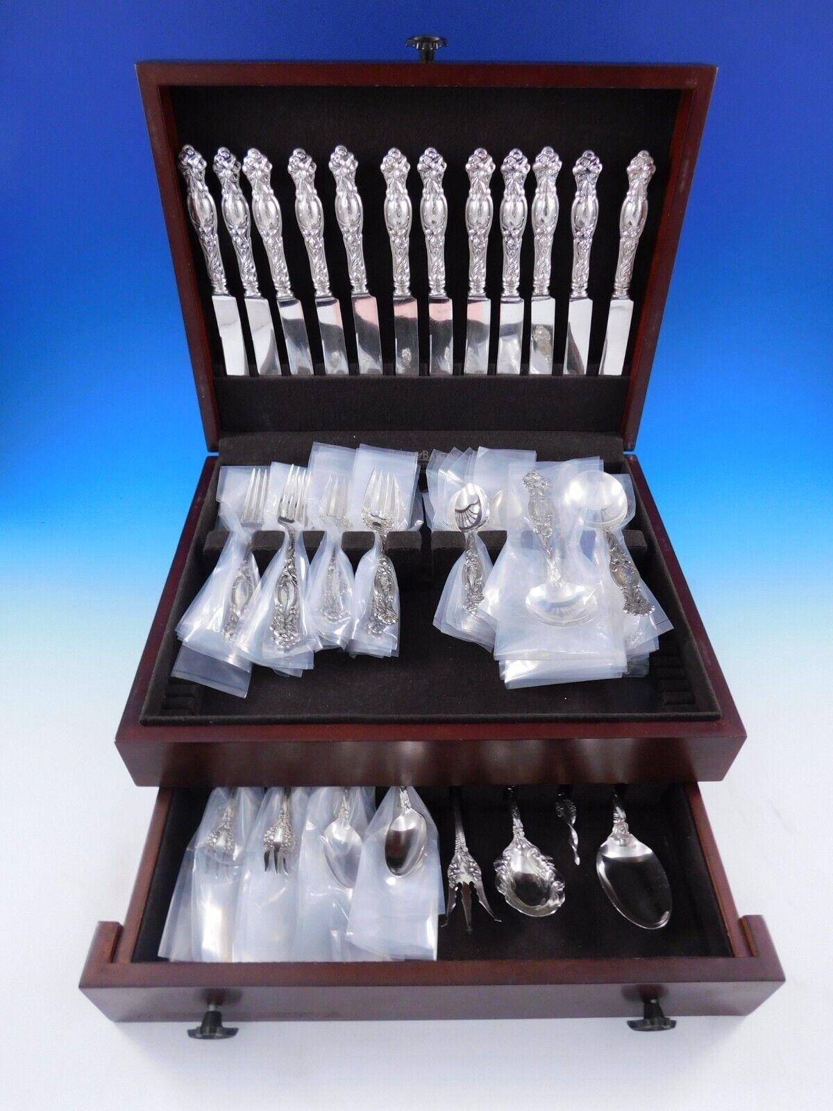 Frontenac by International sterling silver Flatware set - 88 pieces. This pattern was introduced in the year 1903 and features beautiful Art Nouveau lily flowers with leaf detailing that flows down the handle, with more flowers on the shoulders of