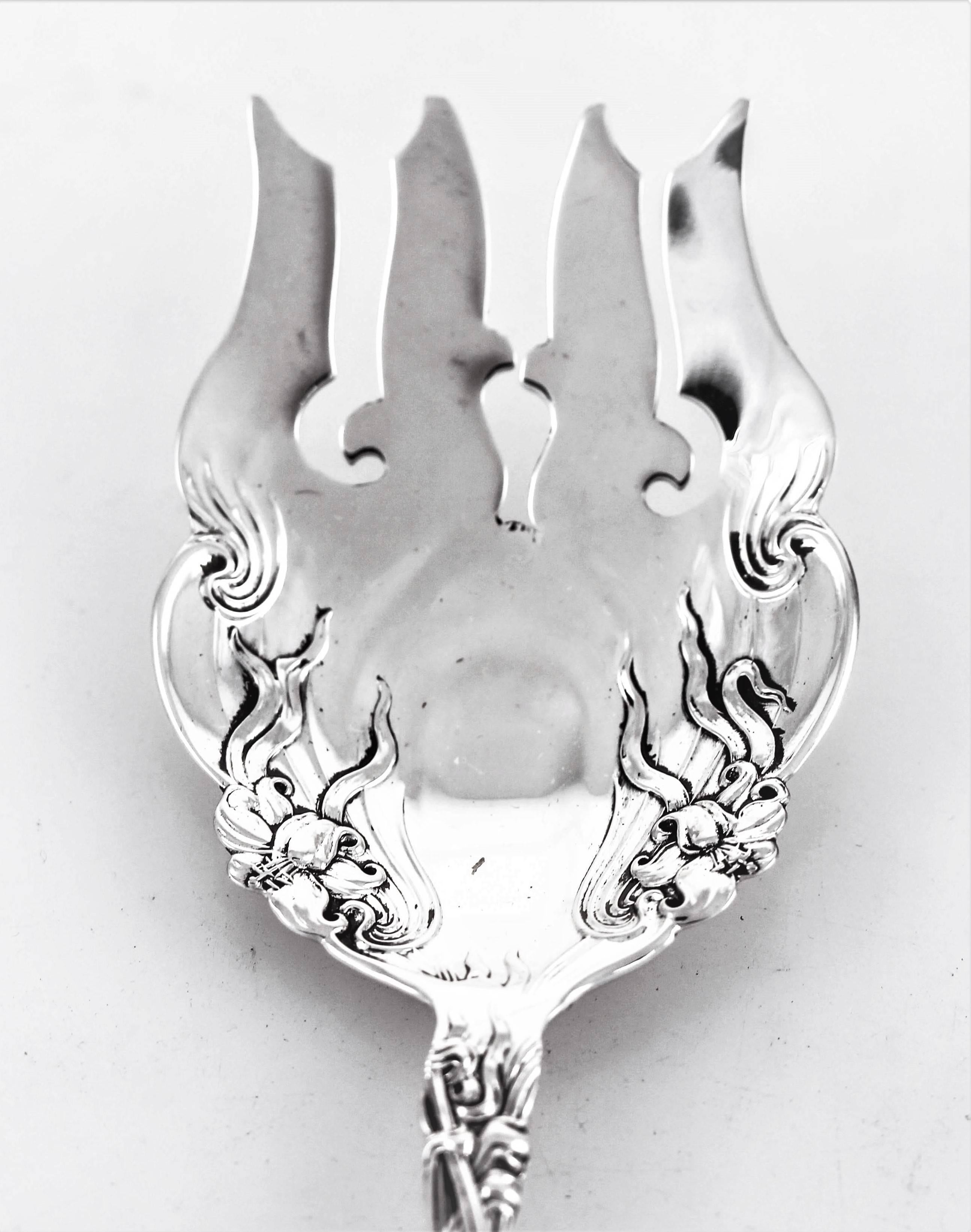 One of the all time most beautiful patterns by the International Silver Company. Drawing on the Art Nouveau period of the early 1900s blown out flowers and leaves decorate the handle and parts of the tine. A reaction to the academic art of the 19th