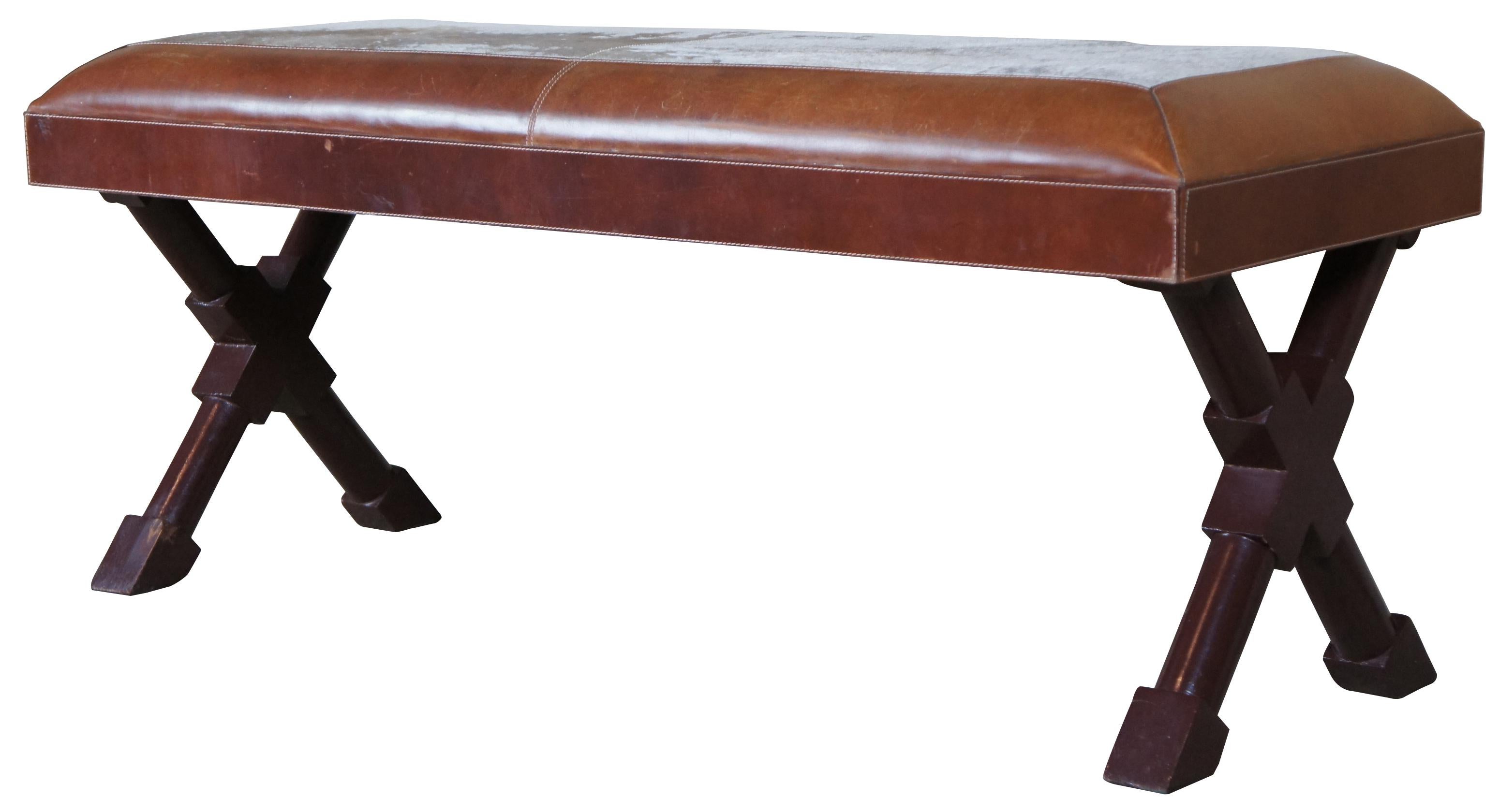 Frontgate X-frame French Empire inspired bench. Upholstered in a brown leather with cowhide along the top. Measure: 48