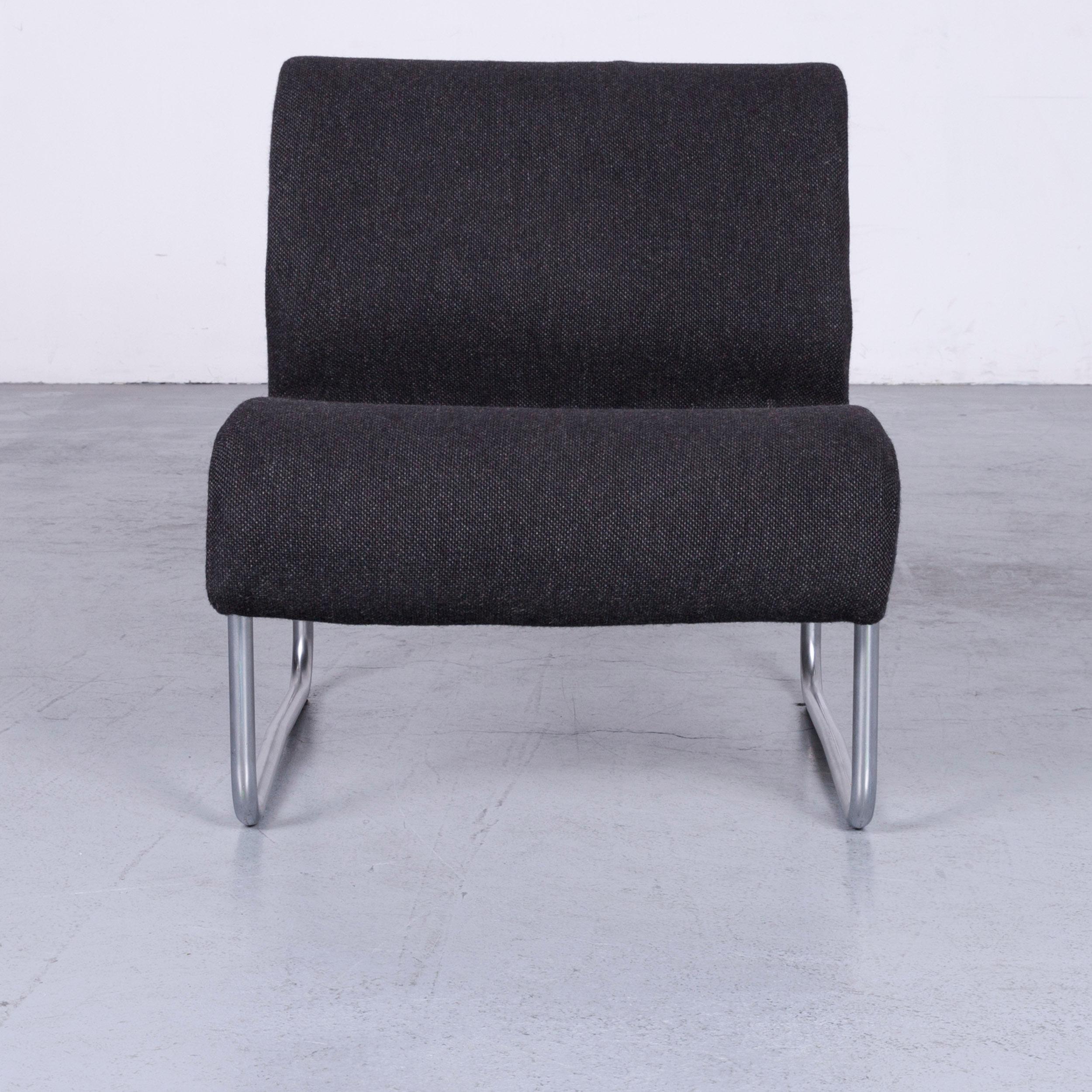 Grey colored original Fröscher Sitform designer chair, designed by Jürgen Lange, in a minimalistic and modern design.