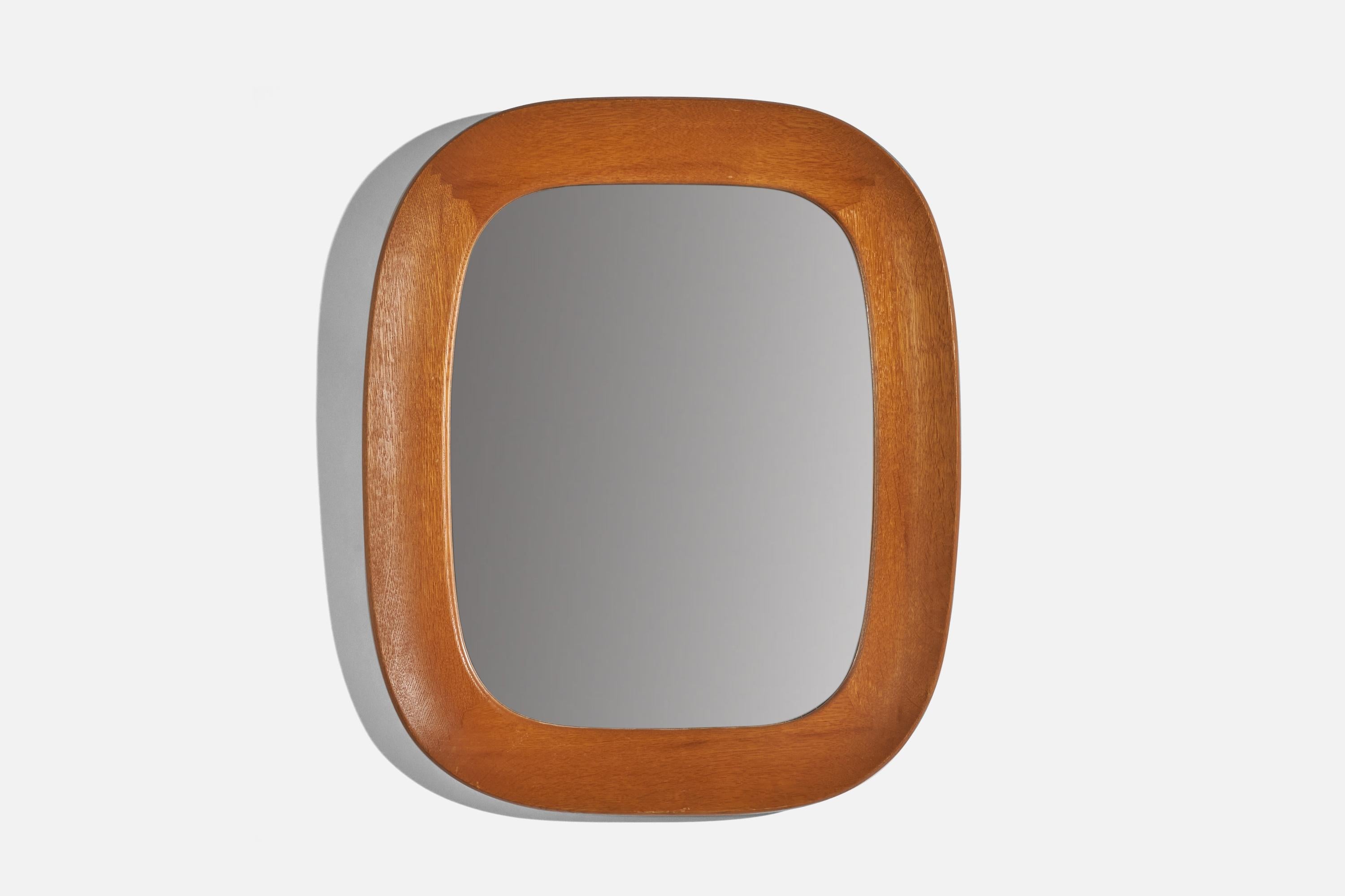 An oak wall mirror designed and produced by Fröseke, AB Nybrofabriken, Sweden, 1960s. 