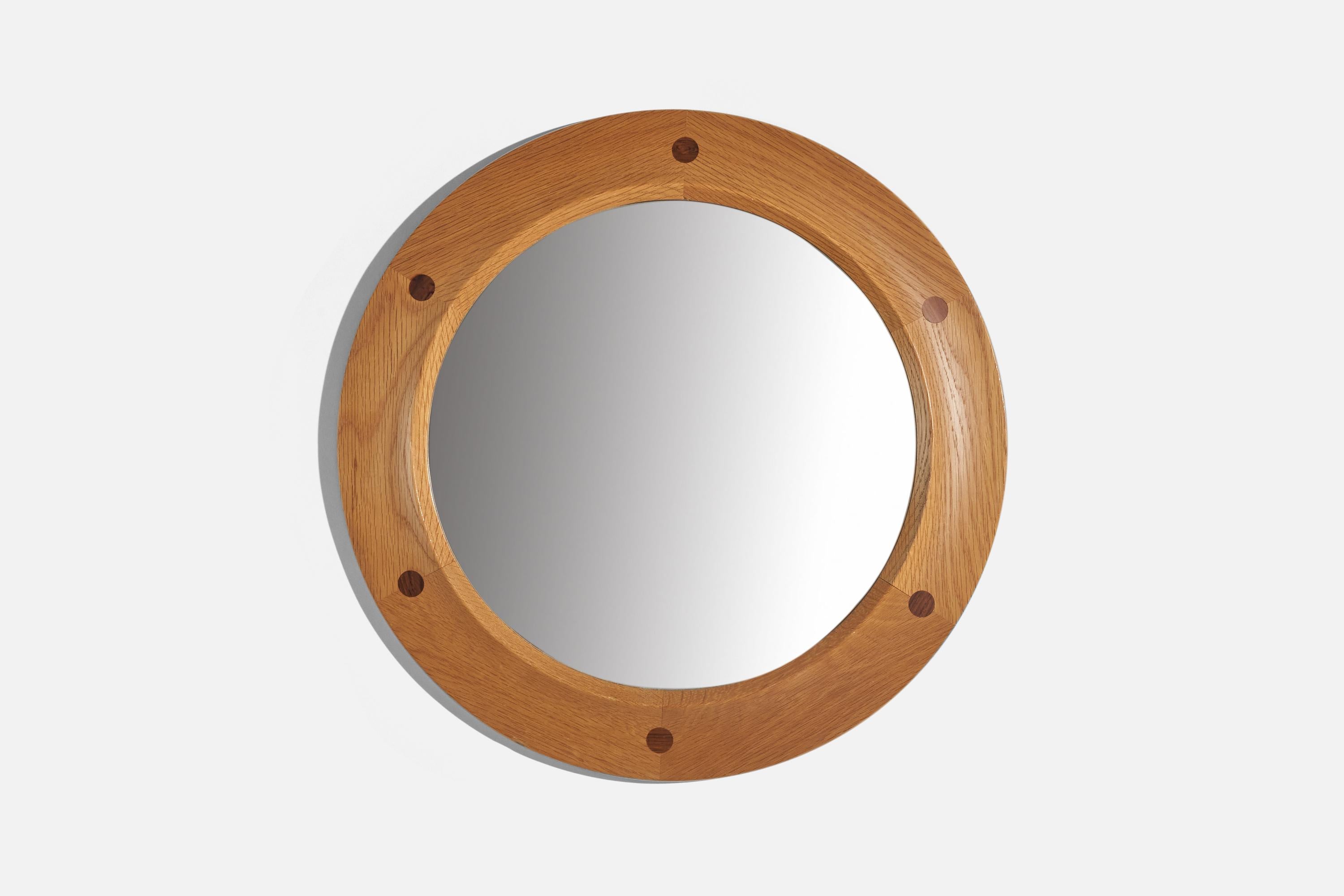 A stained oak and teak wall mirror designed and produced by Fröseke, AB Nybrofabriken, Sweden, 1950s.