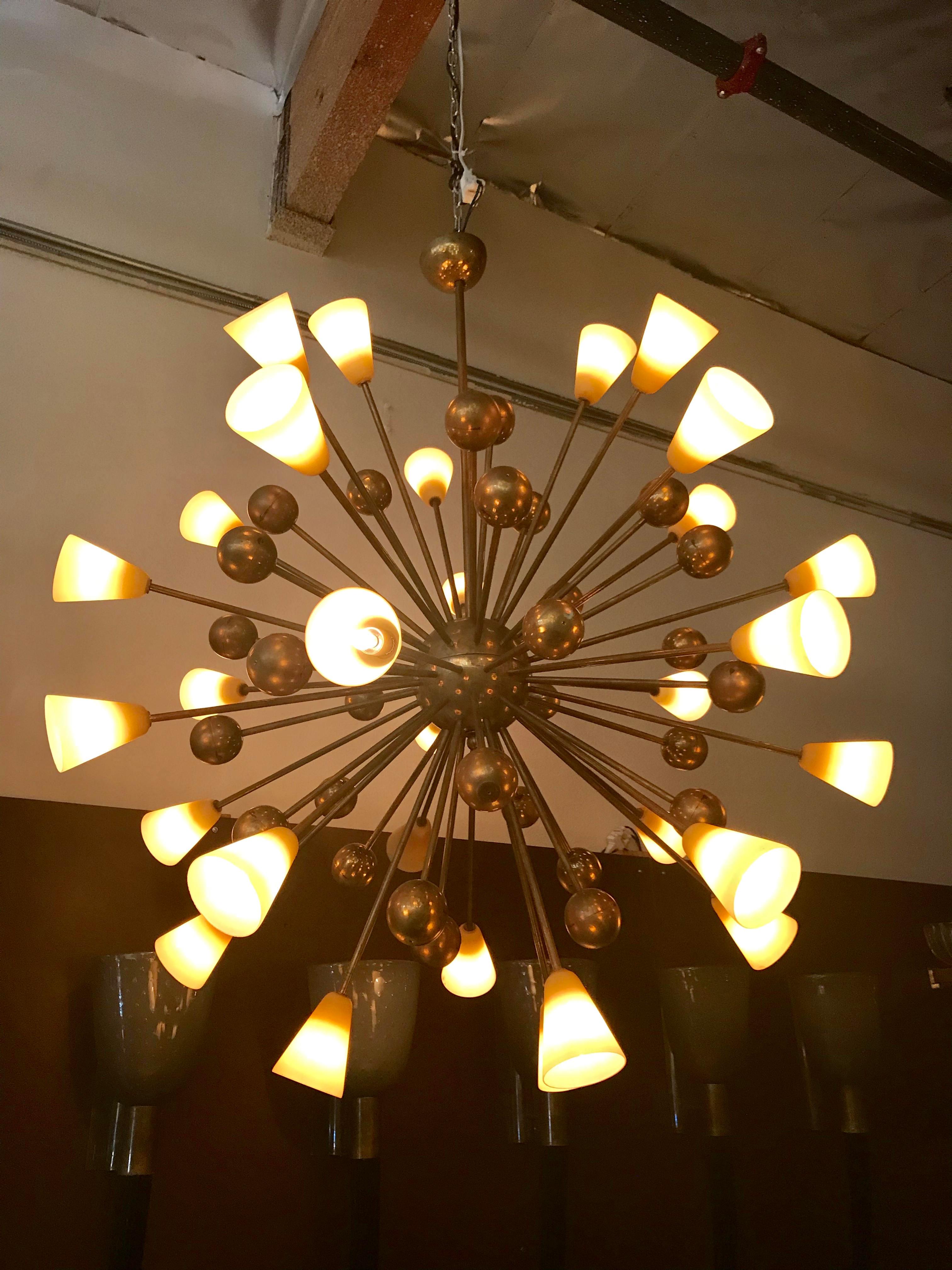 Italian chandelier with hand blown frosted amber Murano glass shades and decorative brass spheres, mounted on brass frame by Fabio Ltd / Made in Italy
30 lights / E12 type / max 40W each
Diameter: 44 inches / Height: 55 inches including rod and
