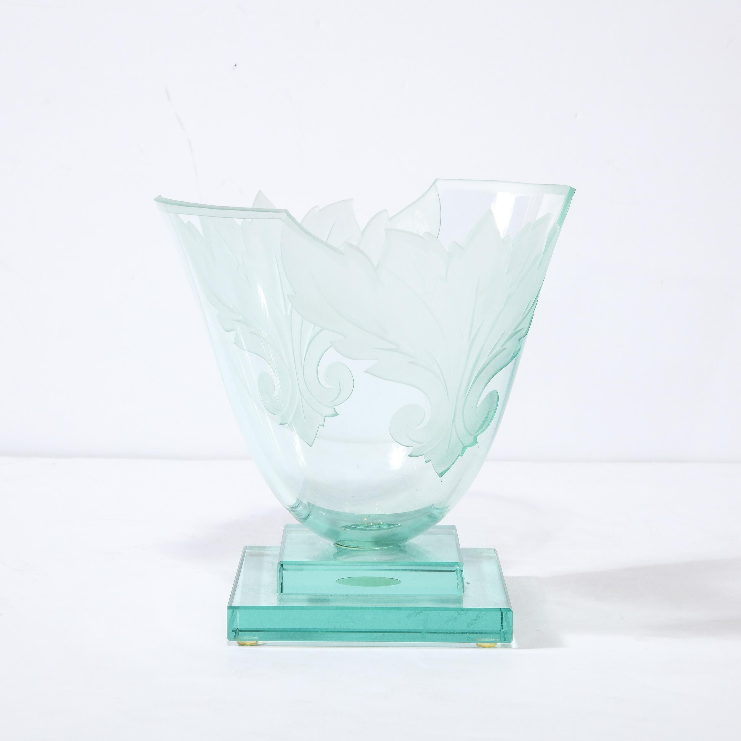 This stunning modernist vase was realized by the esteemed artisan Robert Guenter in the United States circa 1990. It features a tiered skyscraper style geometric base consisting of stacked rectilinear forms from which an urn form body ascends- all