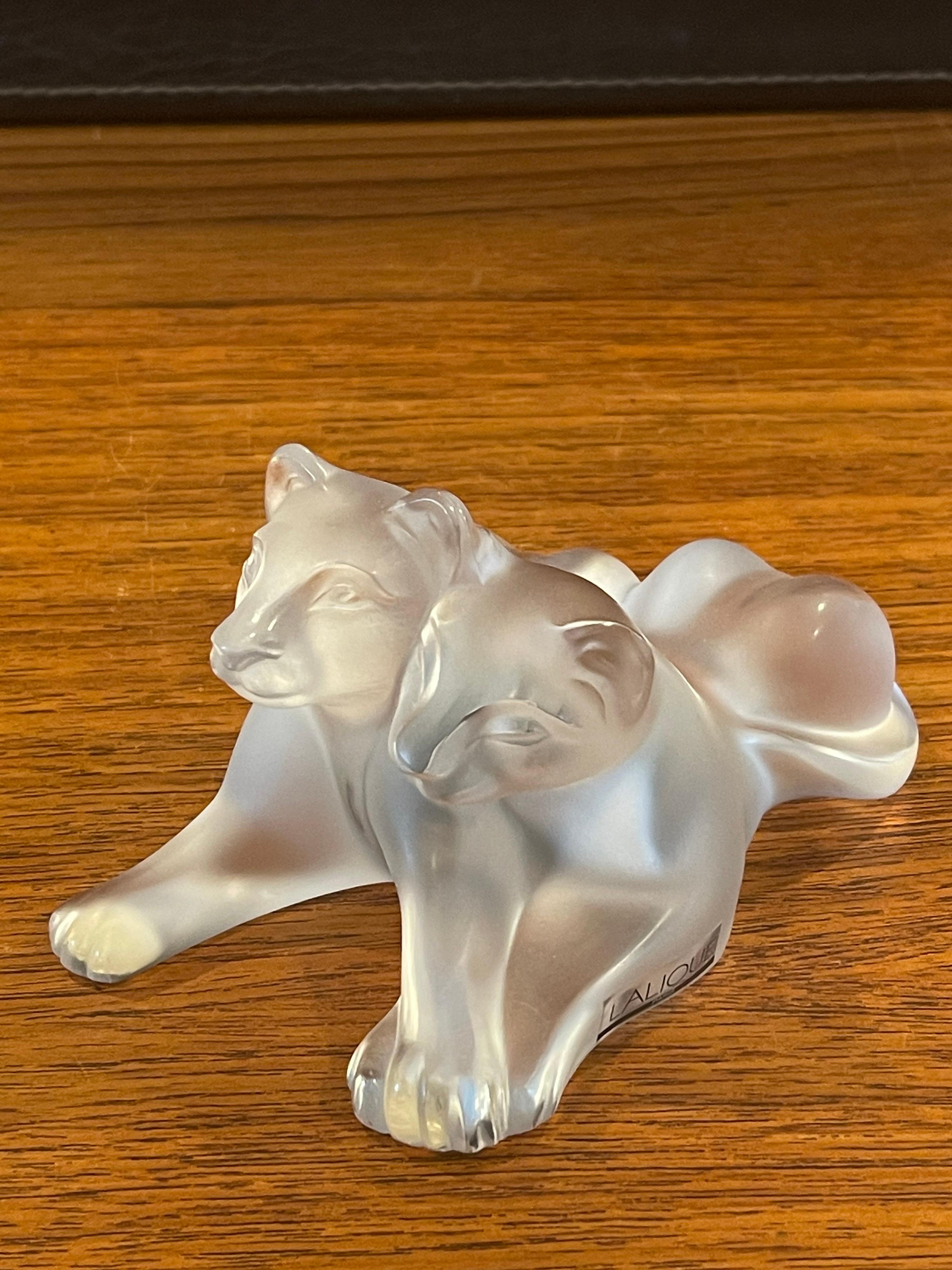 Gorgeous frosted crystal lion cubs sculpture by Lalique of France, circa 1980s. The piece is in very good condition with no chips or cracks, measures 4