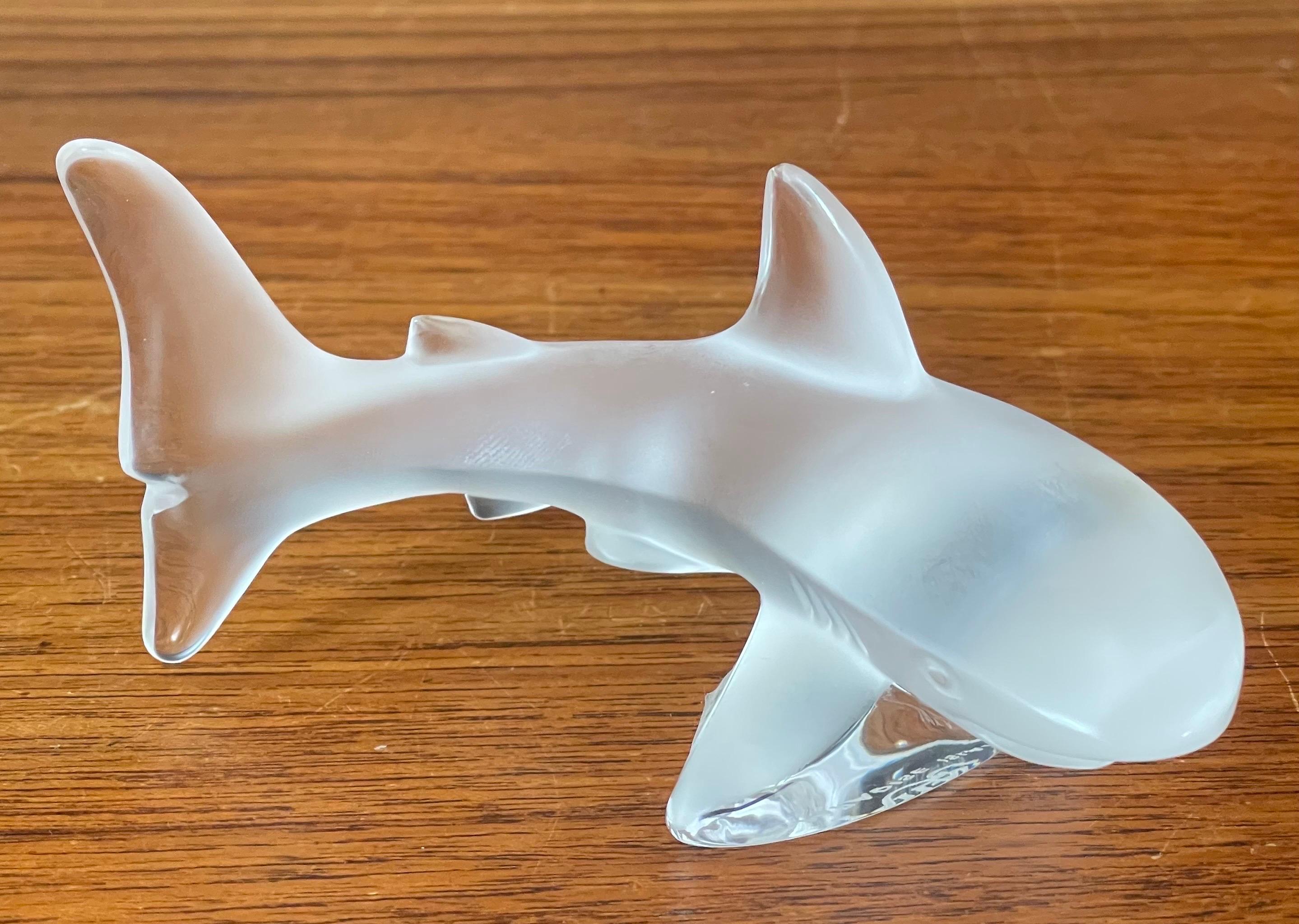 A beautiful frosted crystal shark sculpture by Lalique of France , circa 1990s. This gorgeous piece was a limited edition sculpture and is marked Paradise Island on the underside. The piece is in very good vintage condition with no chips or cracks