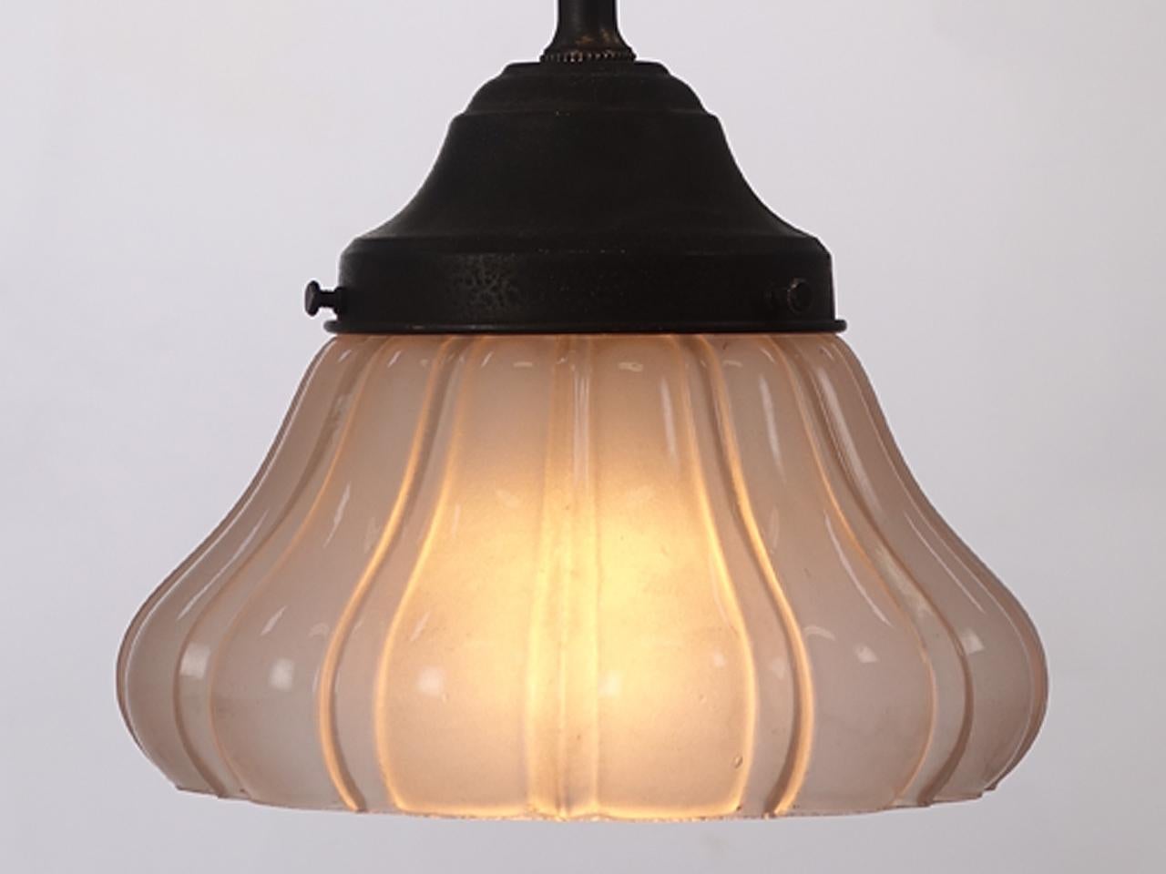 We only have a few of these beautiful and delicate frosted pendents. The look is very early and may have originally been used for gas lamps in the 1800s. They give off a nice warm glow. The casting is deep giving it a rich 3D feel. They are priced