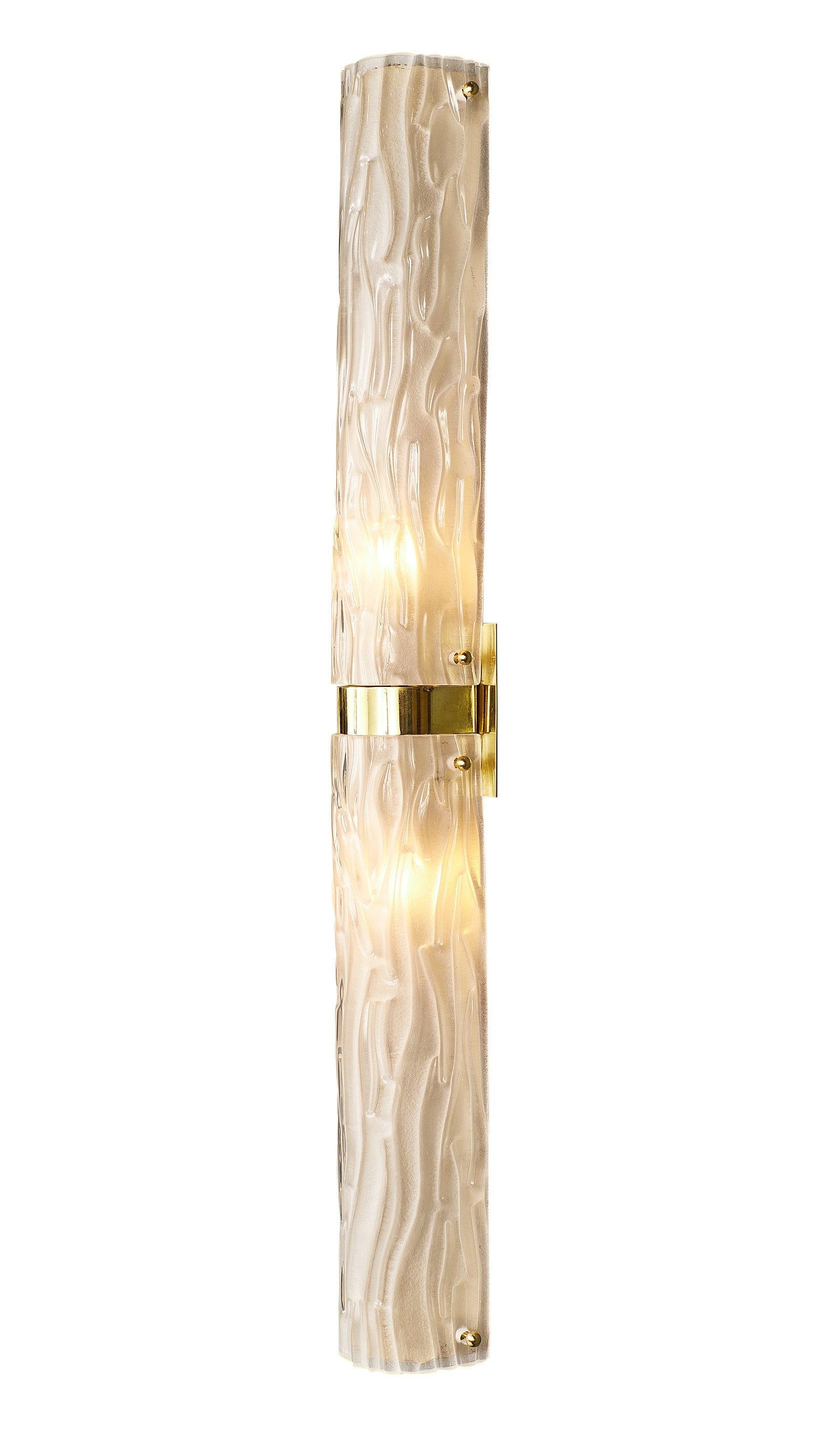 A glowing pair of Murano textured frosted glass and brass sconces. Handblown in Italy, we fell in love with the high quality, luxury craftsmanship and thickness of the glass. Each sconce holds two candelabra-base bulbs. They have been newly wired to