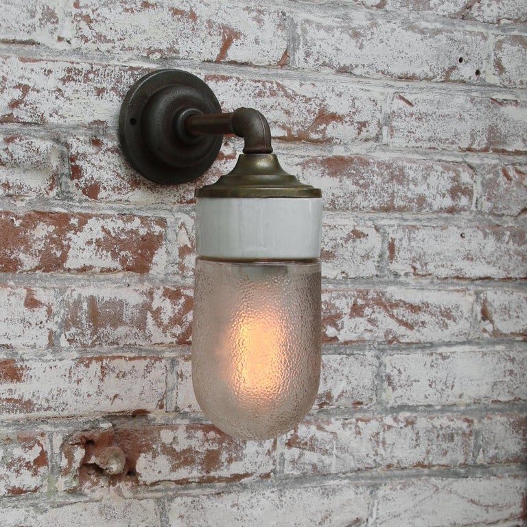 20th Century Frosted Glass Brass Vintage Cast Iron Arm Scones Wall Lights For Sale