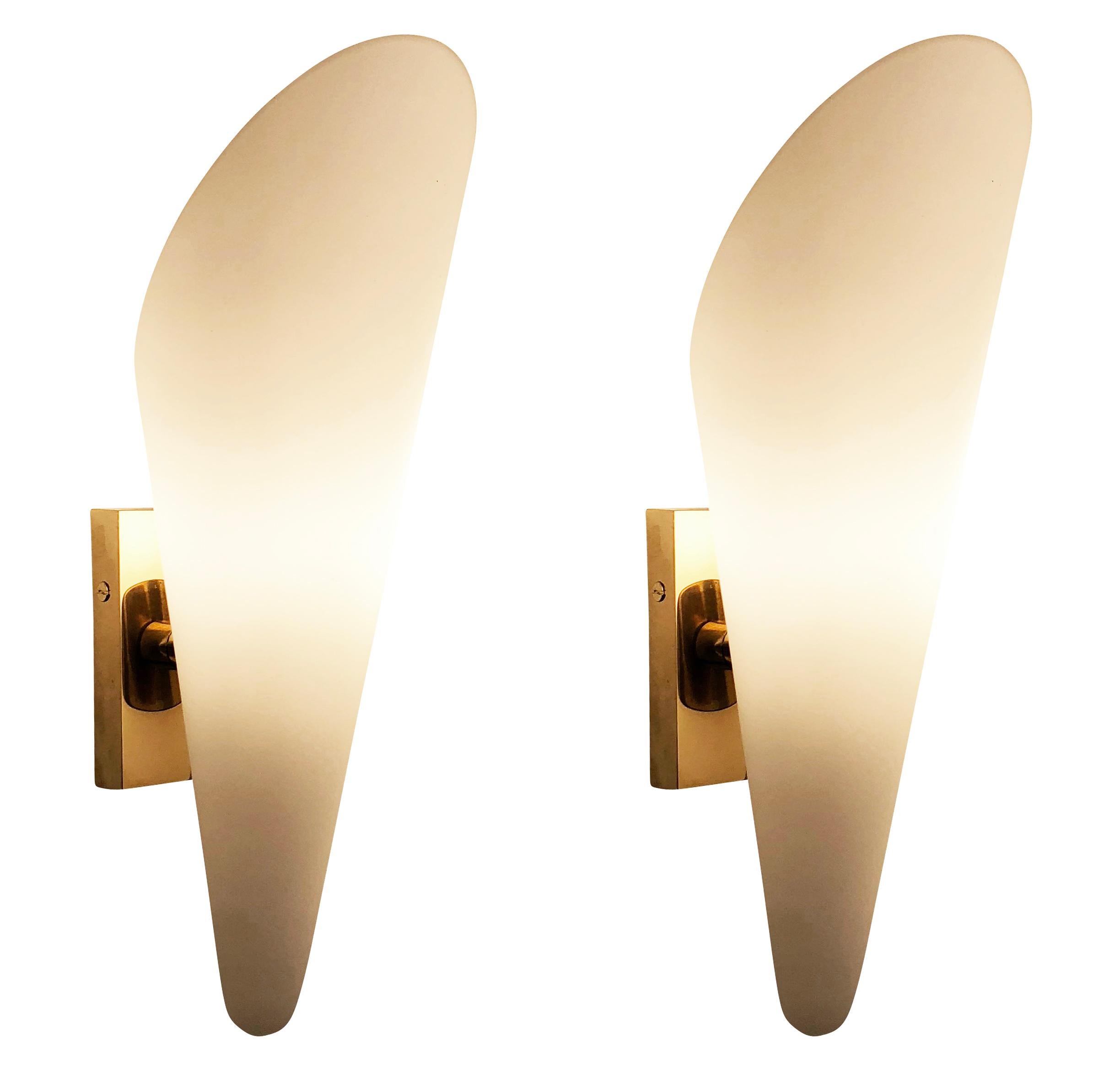 Italian midcentury sconces with conical frosted glass shades and brass hardware. One candelabra socket per light. Sold as pairs-5 pairs available. Price per pair.

Condition: Excellent vintage condition, minor wear consistent with age and