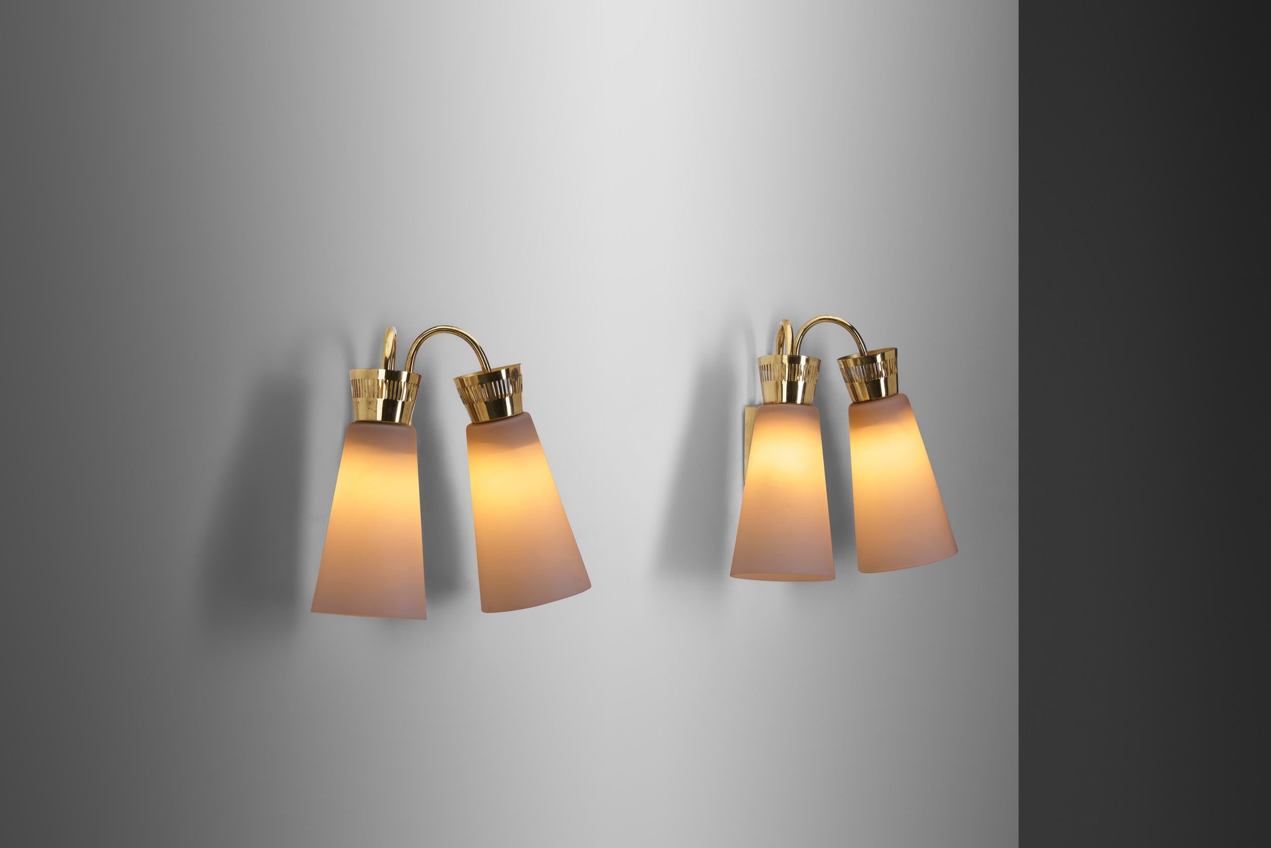 This rare pair of wall lights was designed during the 1950s, an era in which Finland saw the birth of many of its most iconic lighting models. It was a period of consistency, excellence, and sophistication design wise. Itsu, short for Itä-Suomen