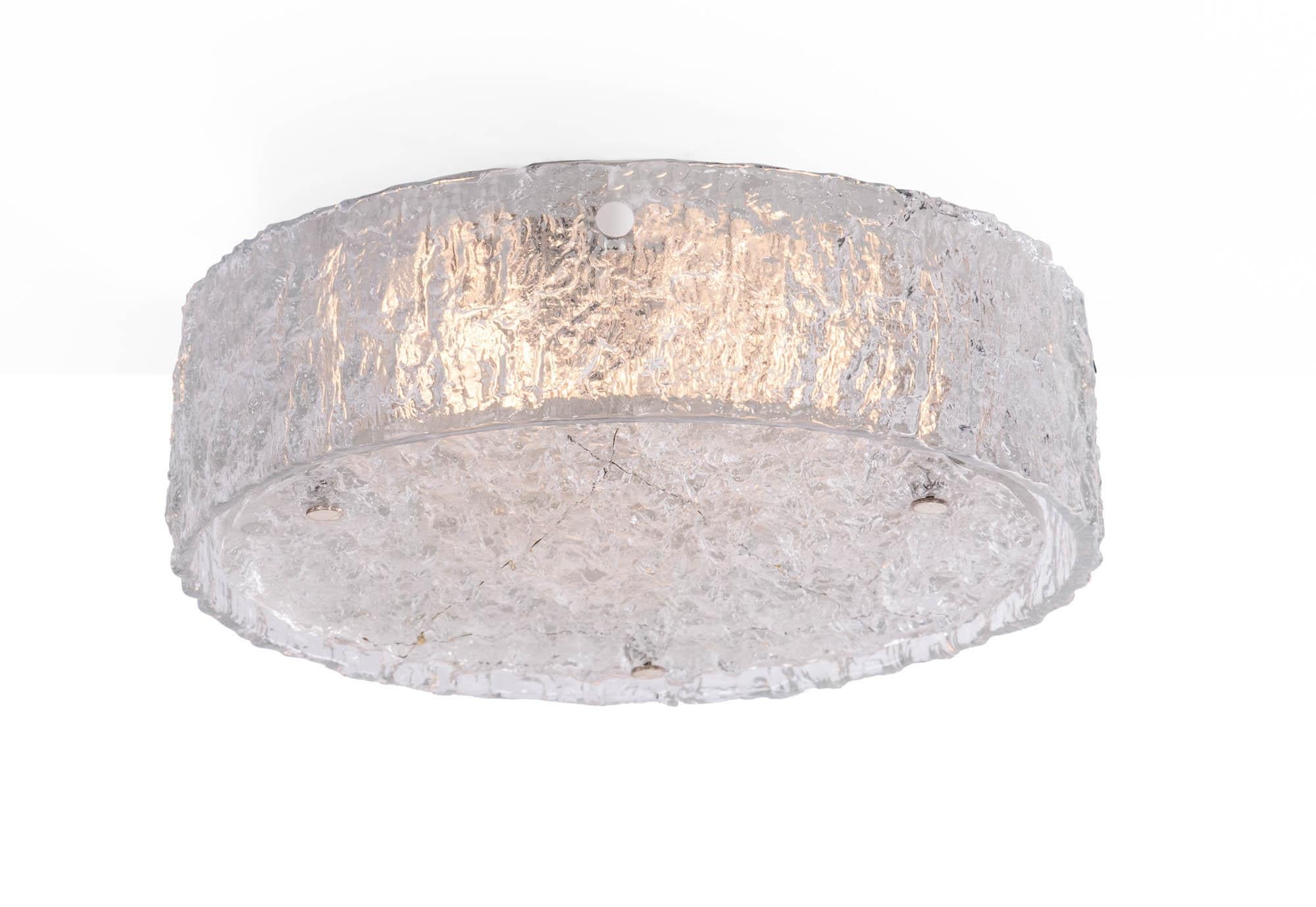 Gorgeous large two part drum-shaped flush mount chandelier with one ring outside and a flat disc made of heavy textured clear iced glass on a white laquered metal frame with chromed nickel finals. Manufactured by Kaiser Lighting, Germany in the