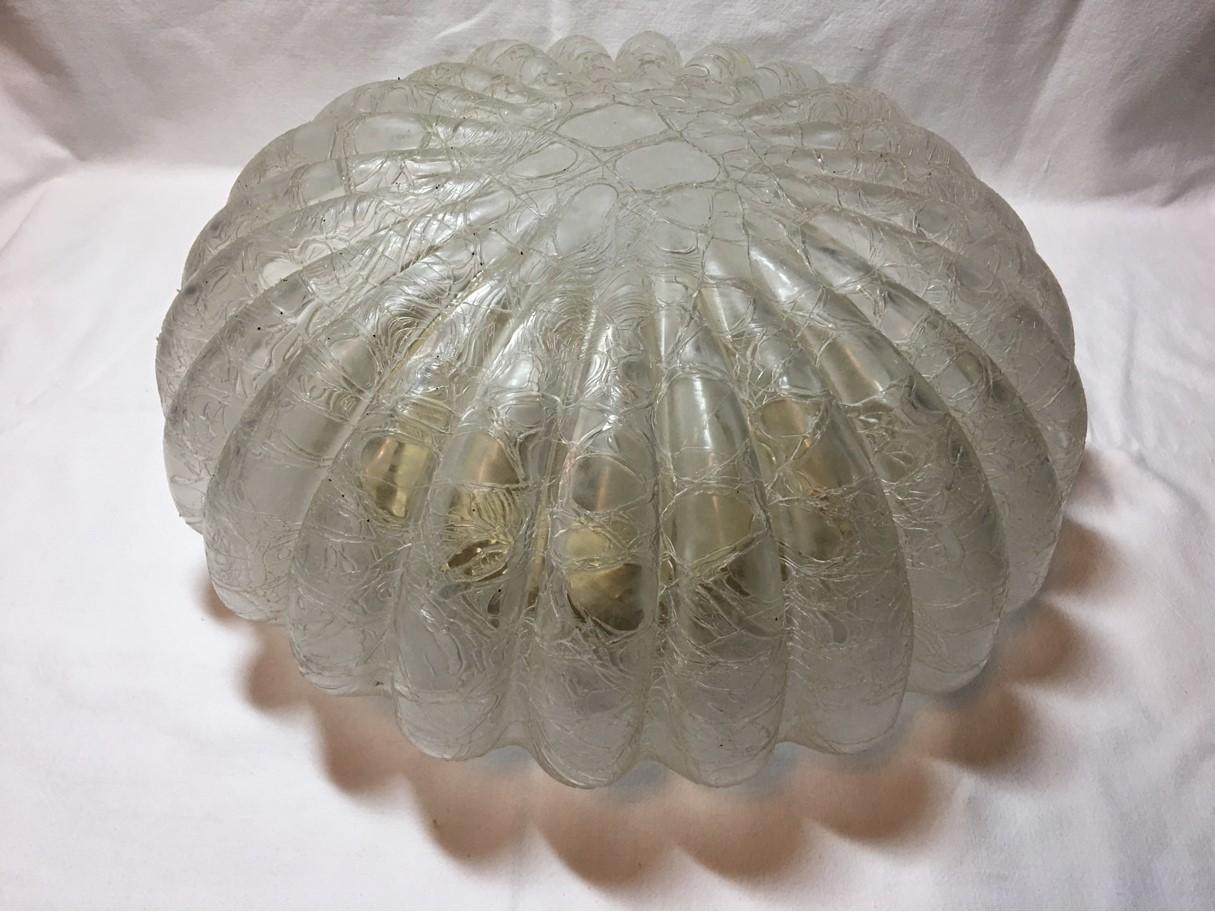 Round flushmount ceiling lamp with a very rare frosted glass cover. A seldom found item with this type of Glass. The fixture requires two European E26 / E27 Edison bulbs, each bulb up to 60 watts. Rewired to meet U.S. standards.
Runde Deckenlampe